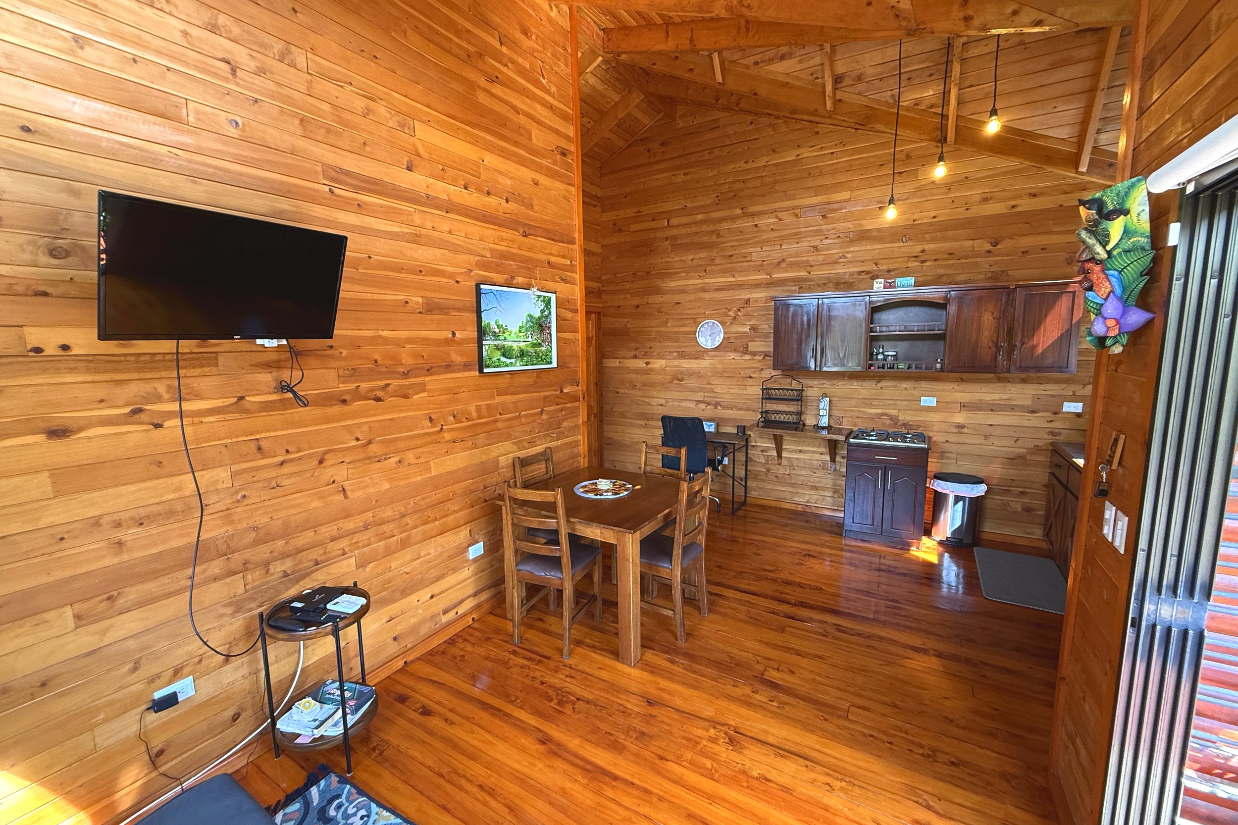 Wooden Cabin Living Area Unique Income Producing Home wooden living and dining area in Bahia, Costa Rica