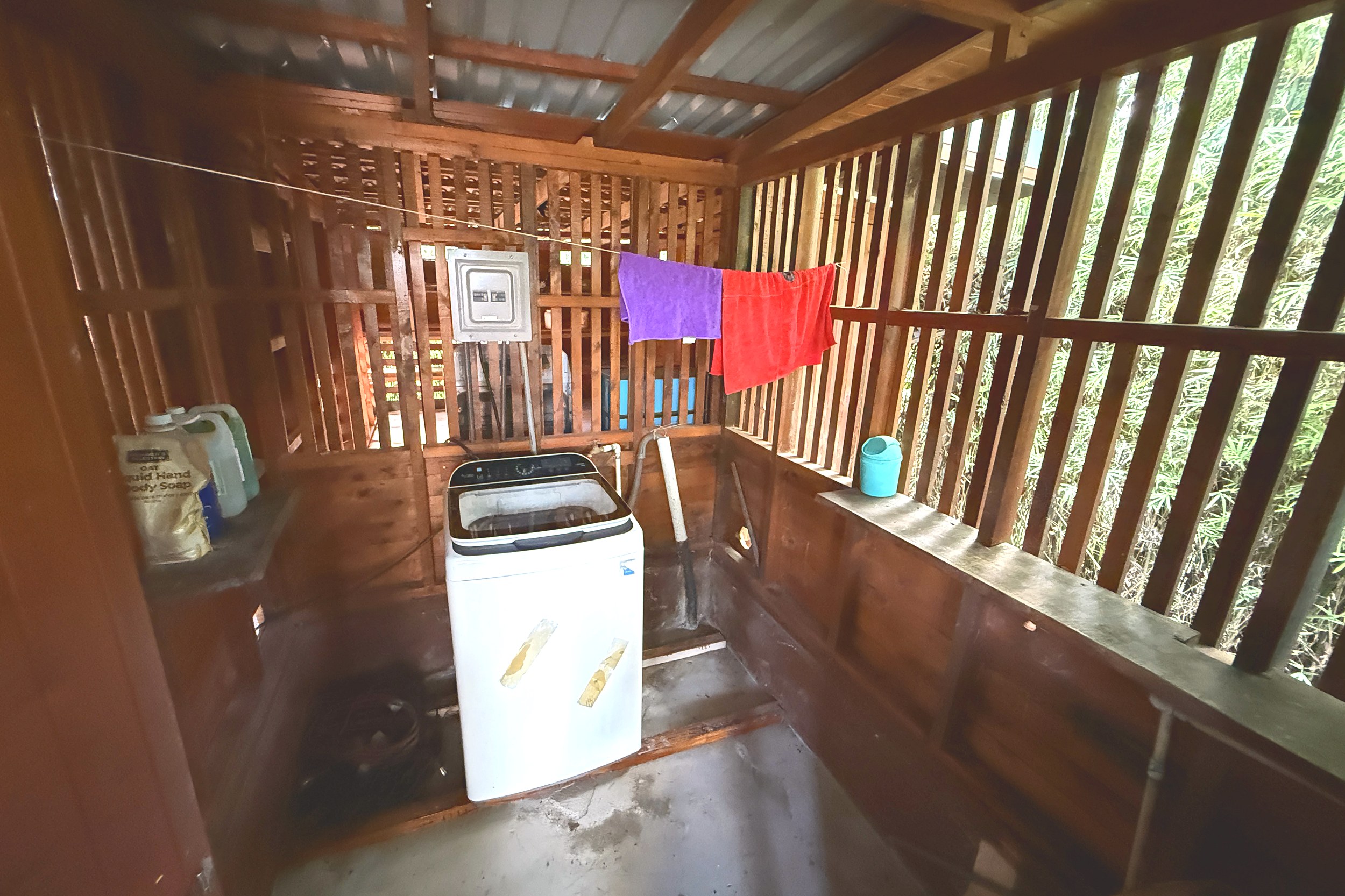 Laundry Area Unique Income Producing Home laundry area with washing machine in Bahia, Costa Rica