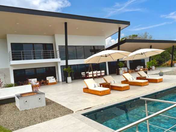 Modern Luxury Villa pool patio and loungers in Costa Rica