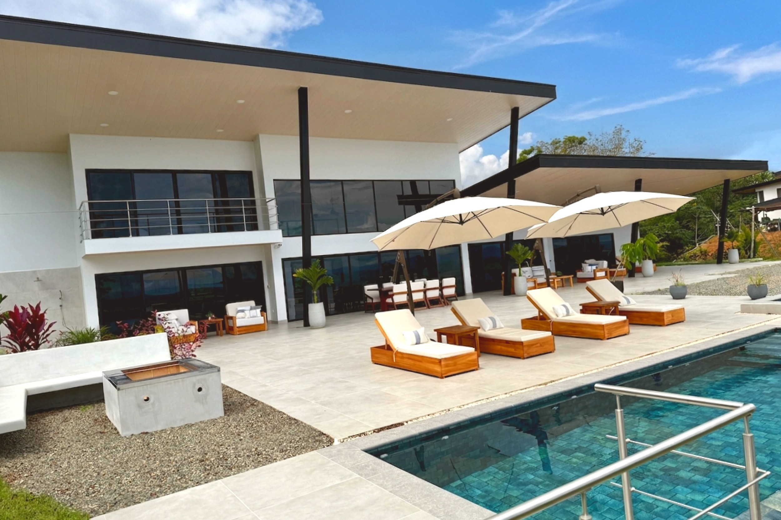Modern Luxury Villa pool patio and loungers in Costa Rica