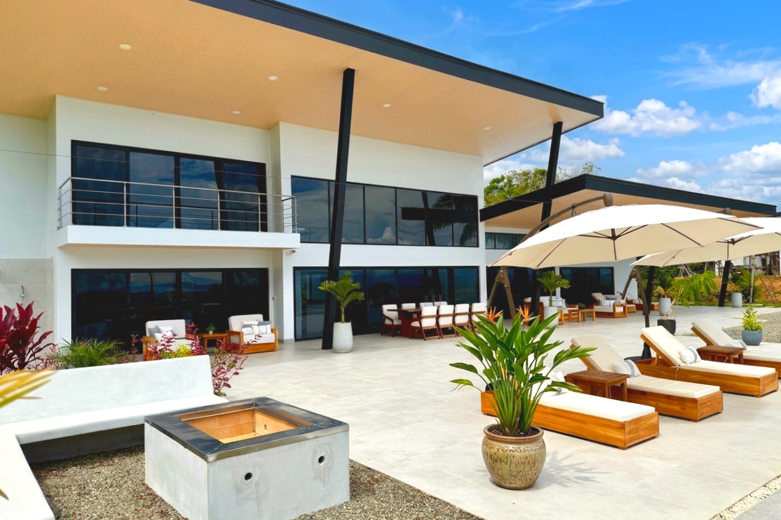 Modern Luxury 4-Bedroom Home terrace with fire pit and loungers in Chontales, Costa Rica
