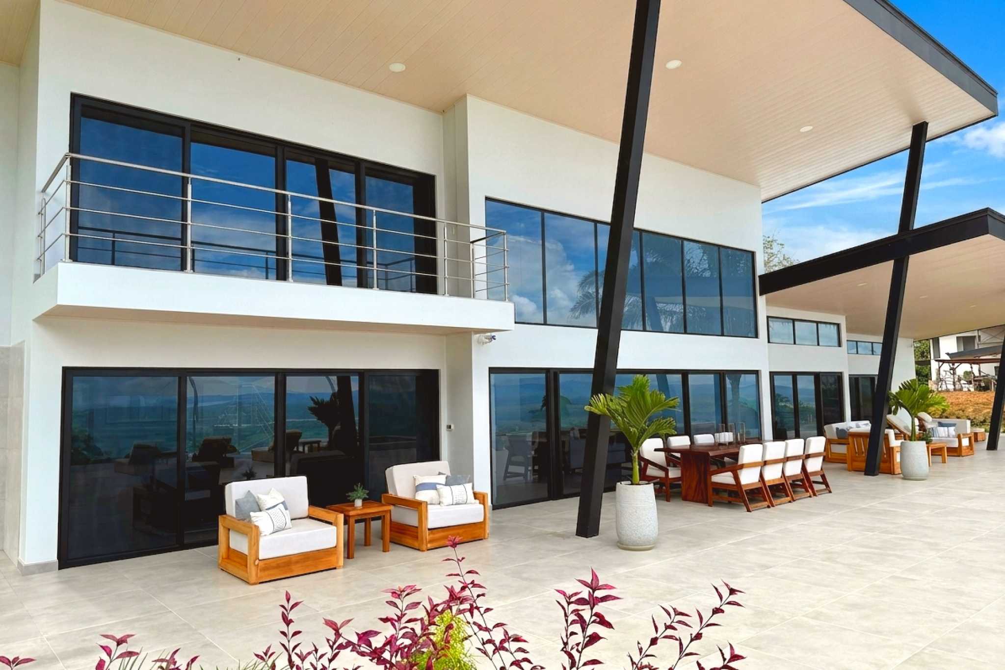 Modern Terrace & Exterior Modern Luxury 4-Bedroom Home exterior patio seating in Chontales, Costa Rica.