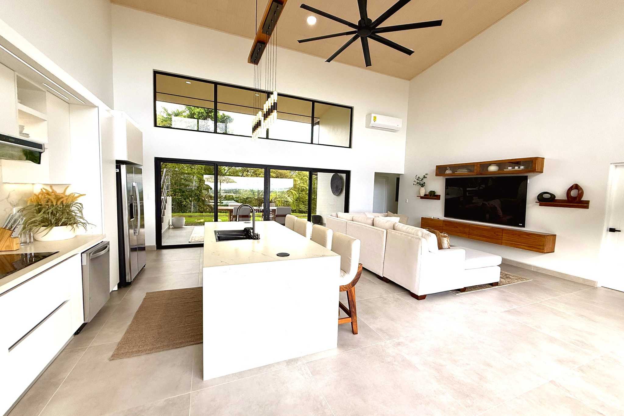 Open Concept Living Area Modern Luxury 4-Bedroom Home open living area and kitchen in Chontales, Costa Rica