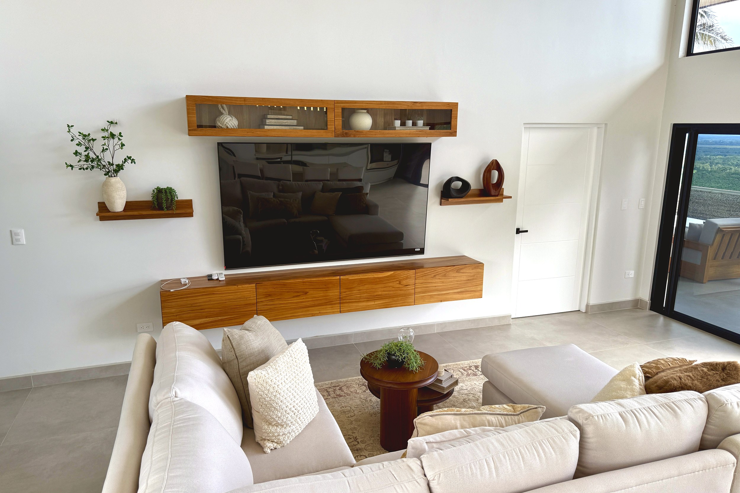 Modern Luxury 4-Bedroom Home living room with TV and sofa in Chontales, Costa Rica.