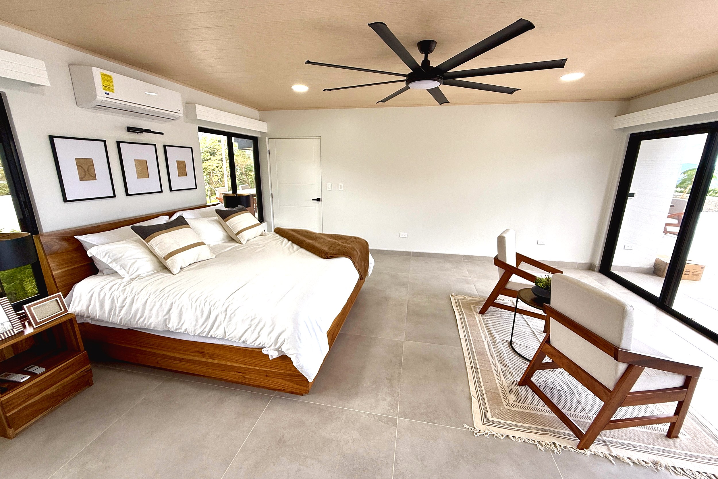 Modern Luxury 4-Bedroom Home master bedroom with wooden bed in Chontales, Costa Rica