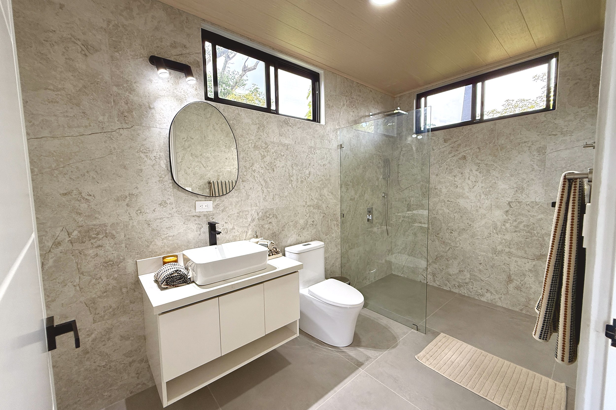 Modern Luxury 4-Bedroom Home guest bathroom vanity and shower in Chontales, Costa Rica