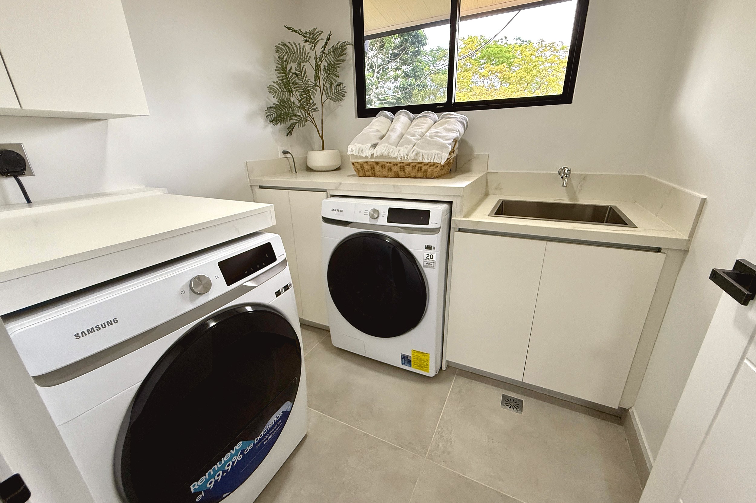 Modern Luxury 4-Bedroom Home laundry room with washer and dryer in Chontales, Costa Rica
