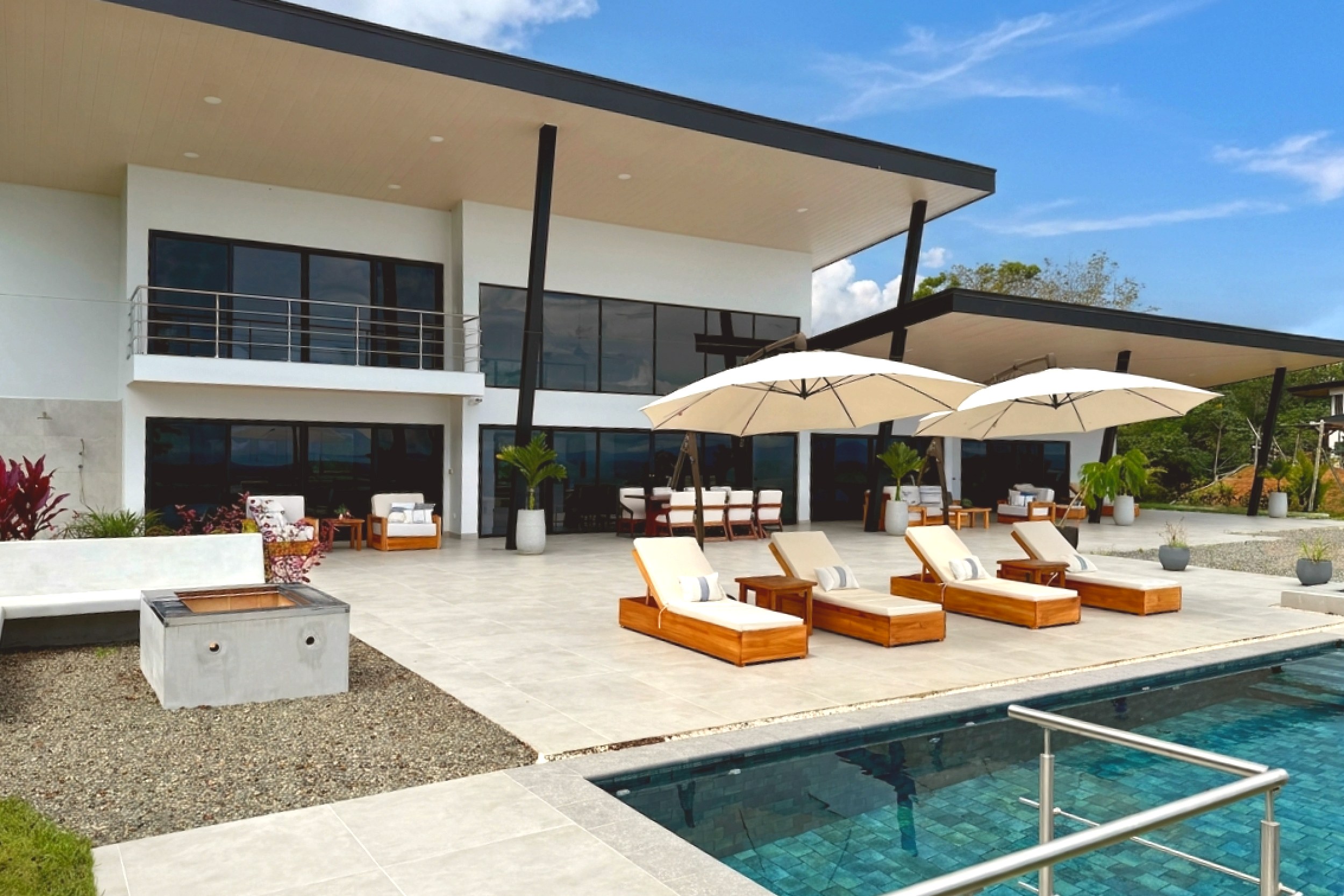 Pool Deck & Lounge Area Modern Luxury Villa pool patio and loungers in Costa Rica