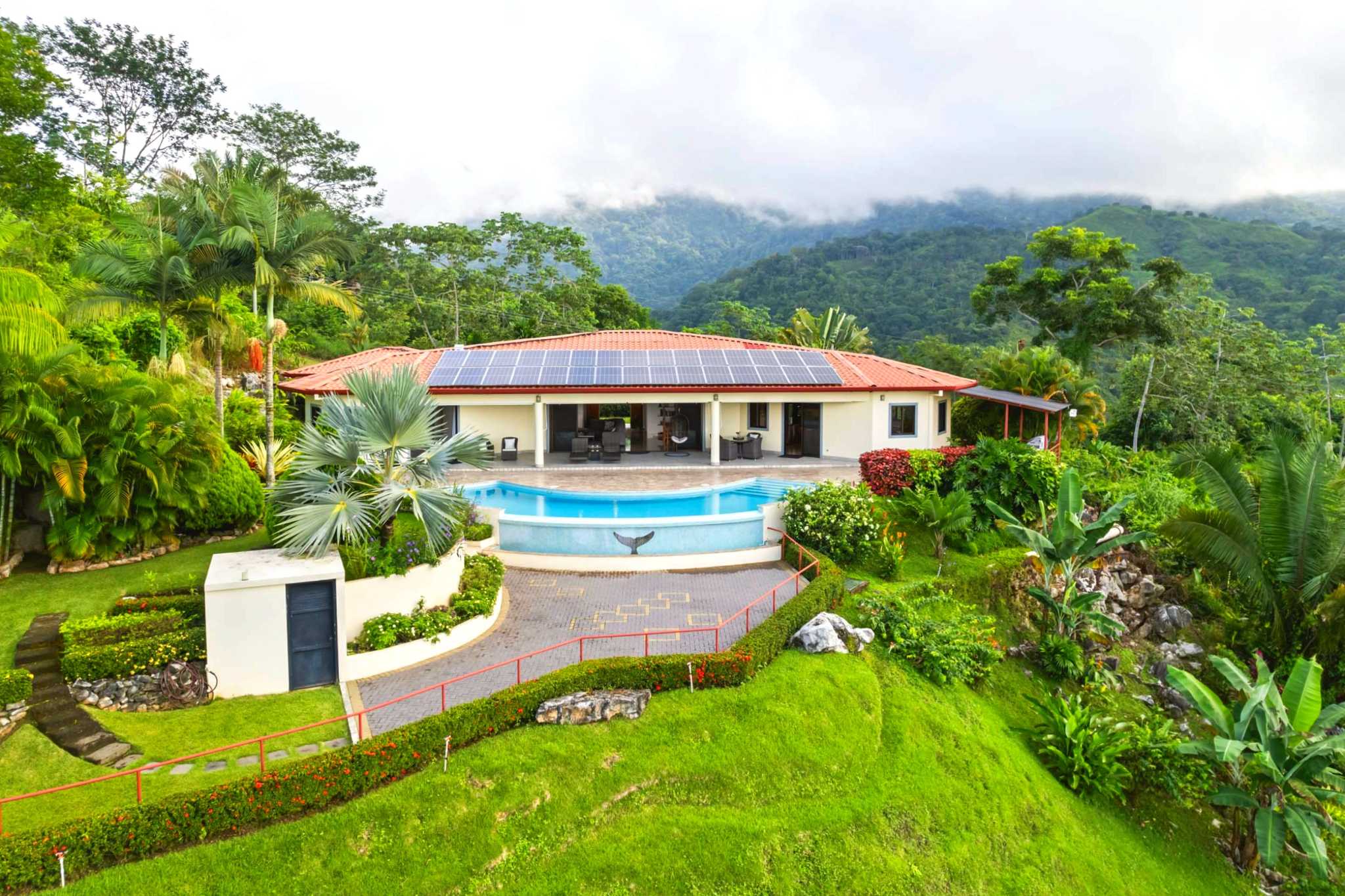 Aerial View of Villa Luxurious Outdoor Living Home aerial view of villa, solar panels, and pool in Chontales, Costa Rica
