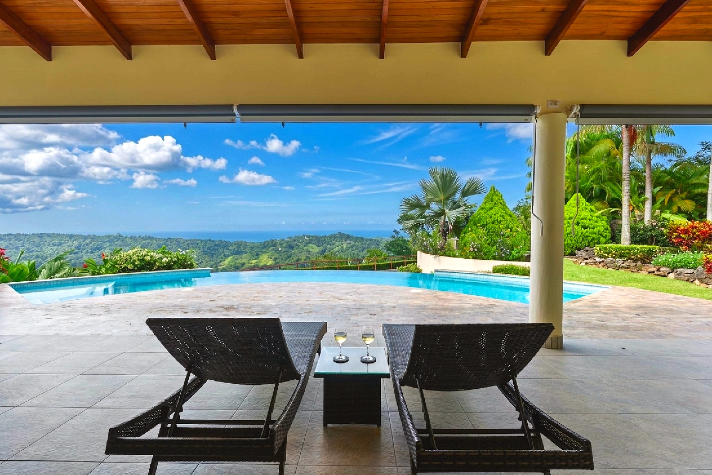 Luxurious Ocean View Home terrace loungers looking at pool in Chontales, Costa Rica