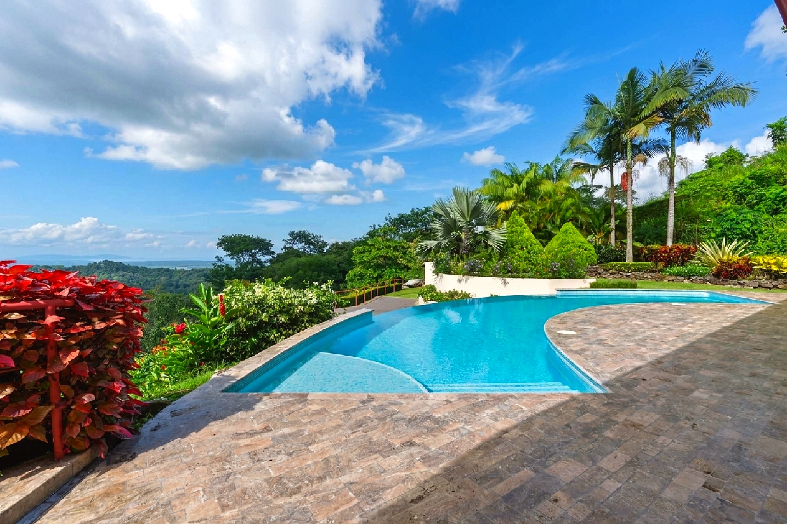 Luxurious Panoramic View Home curved pool and stone terrace in Chontales, Costa Rica