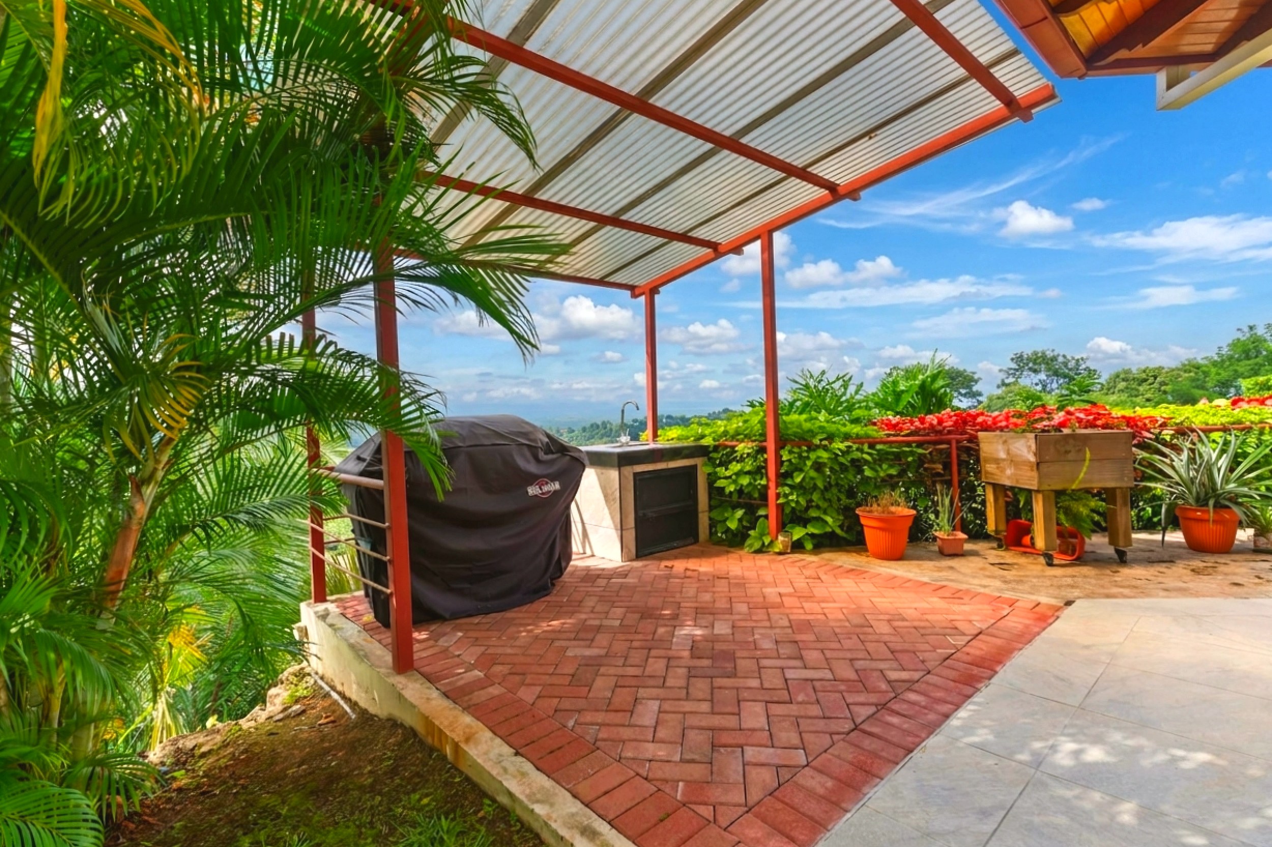 Luxurious Ocean View Home outdoor BBQ area on brick terrace in Chontales, Costa Rica