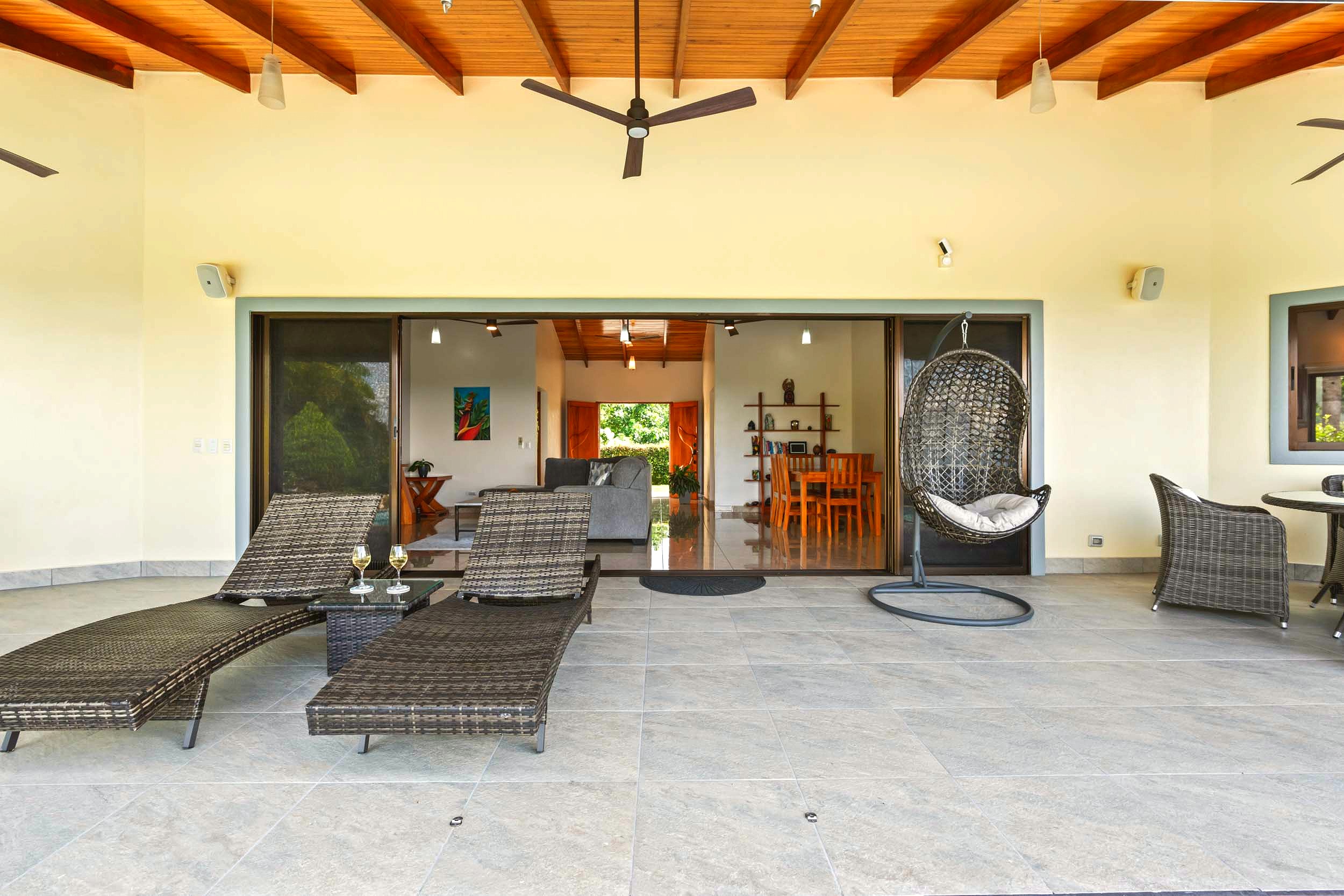 Luxurious Ocean View Home covered terrace with loungers in Chontales, Costa Rica.