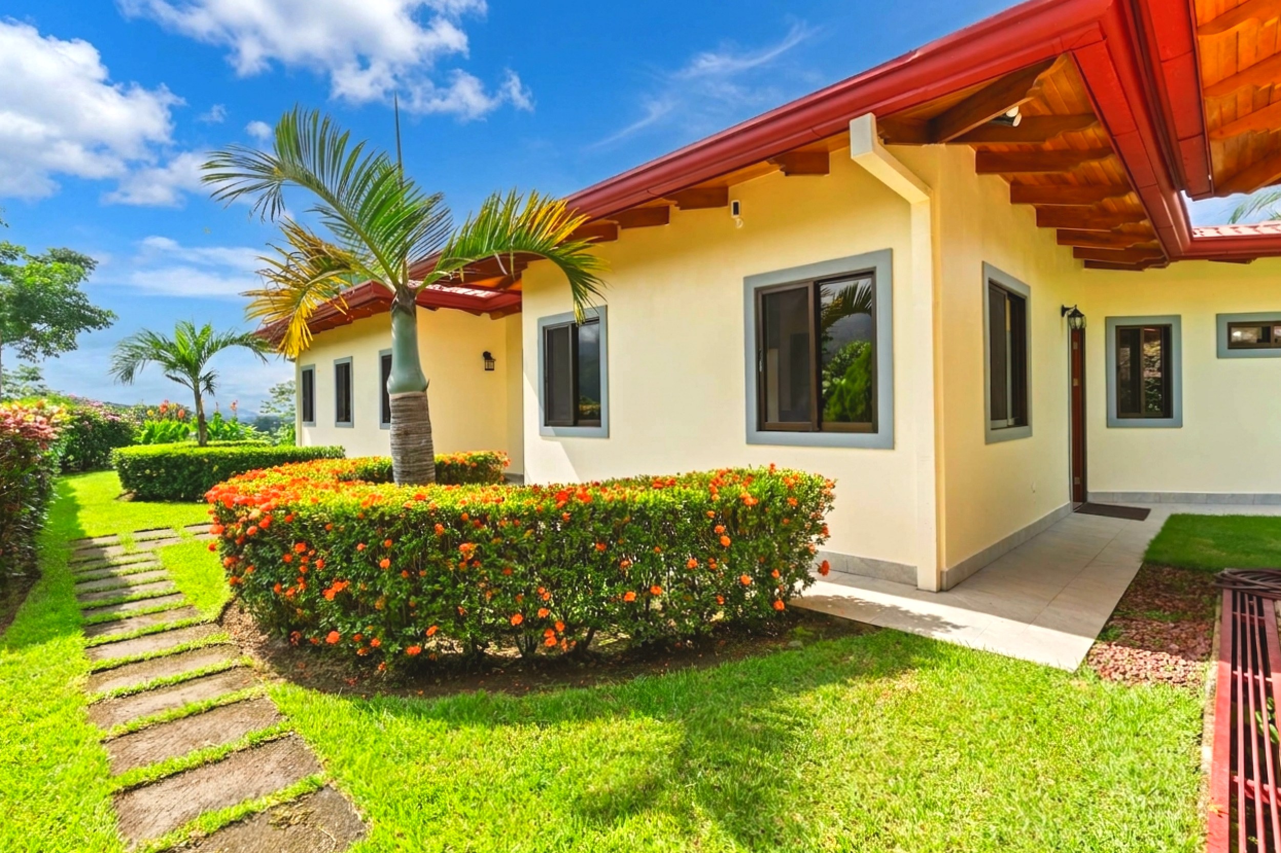 Luxurious Home front exterior and garden pathway in Chontales, Costa Rica.