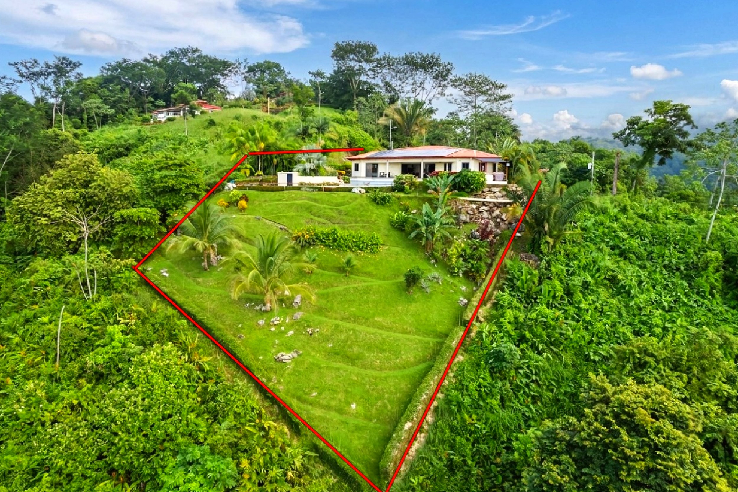 Luxurious Ocean View Home aerial drone view with red lot outline in Chontales, Costa Rica