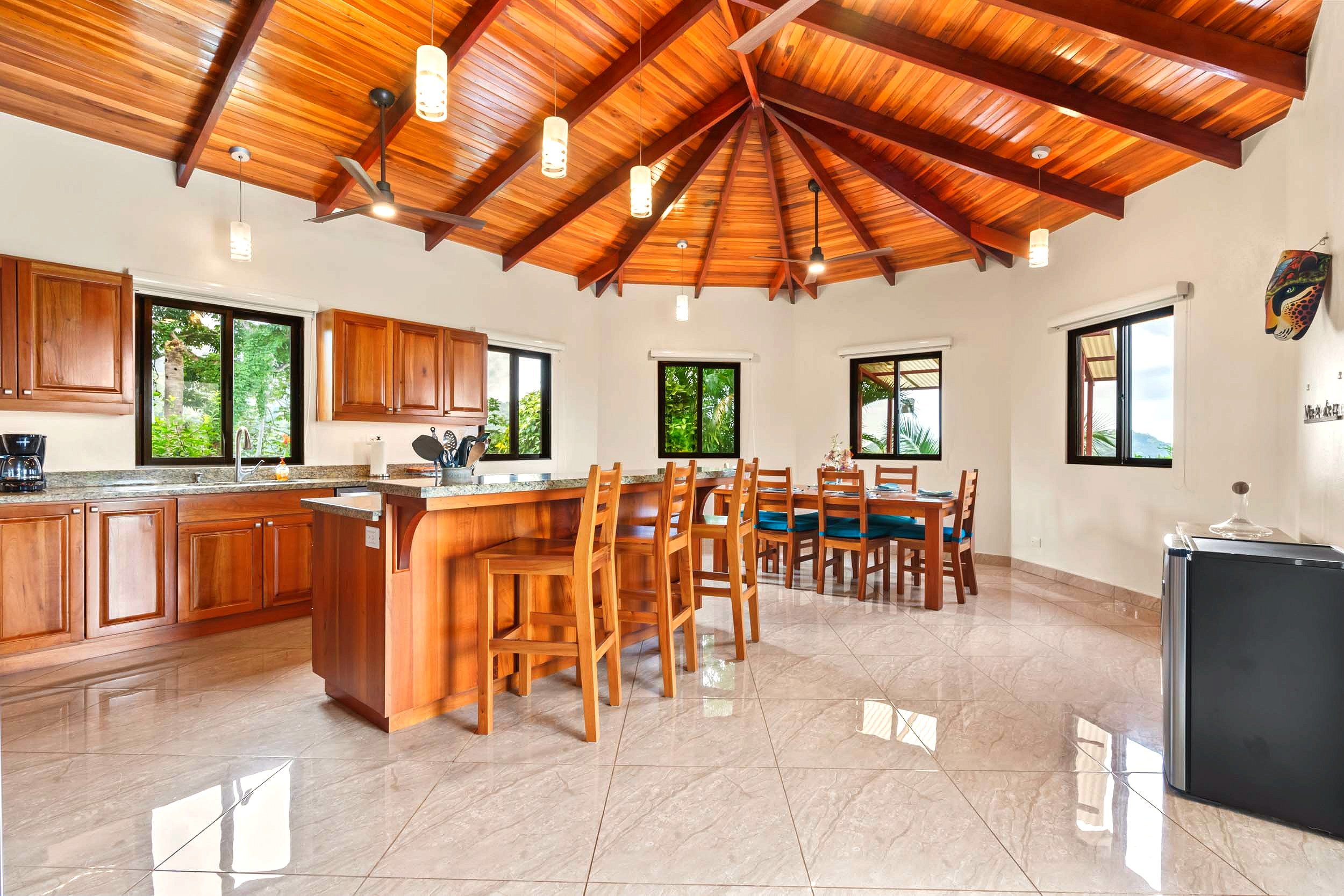 Luxurious Ocean View Home kitchen with wood ceiling and island in Chontales, Costa Rica.