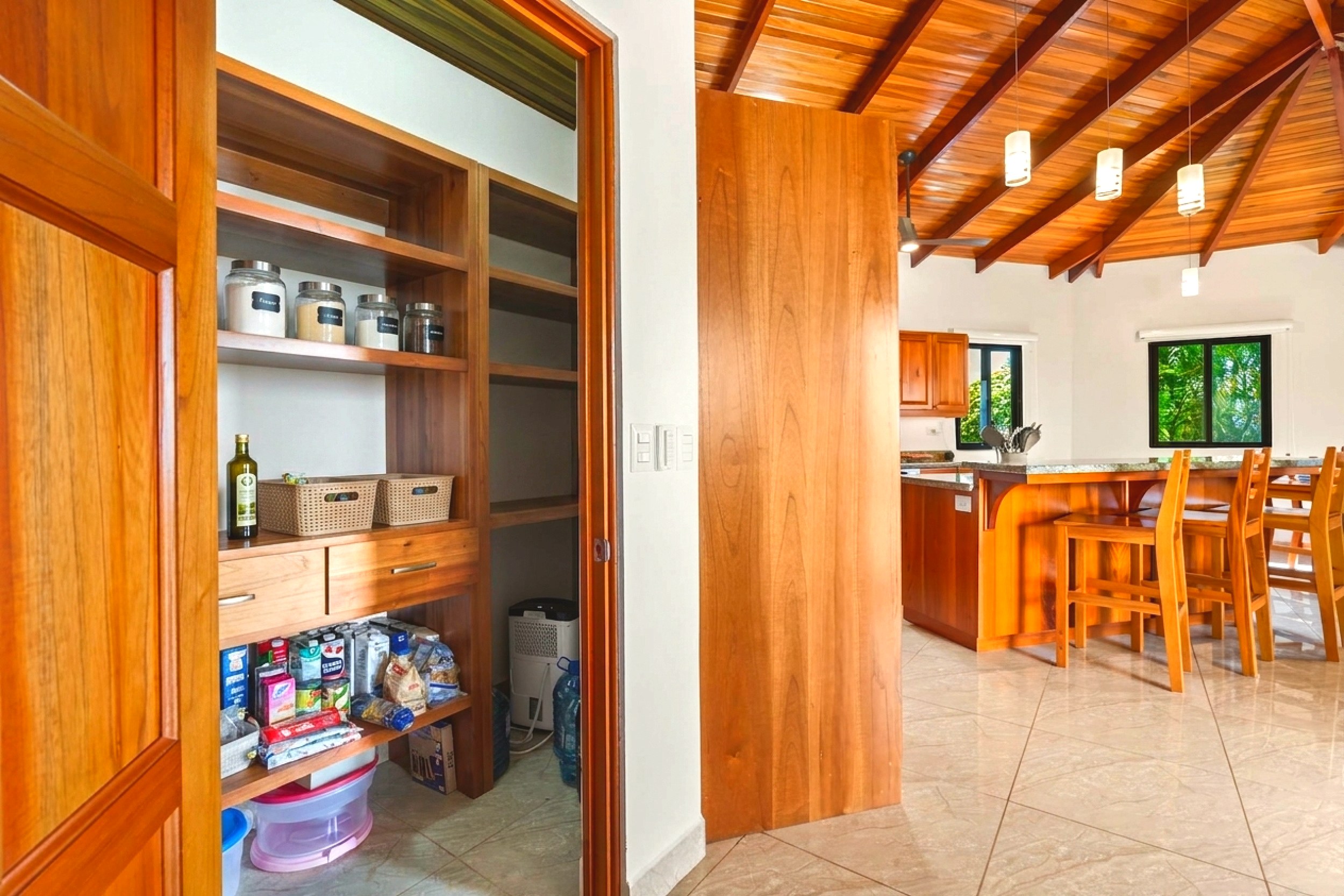Luxurious Ocean View Home walk-in pantry looking into kitchen in Chontales, Costa Rica