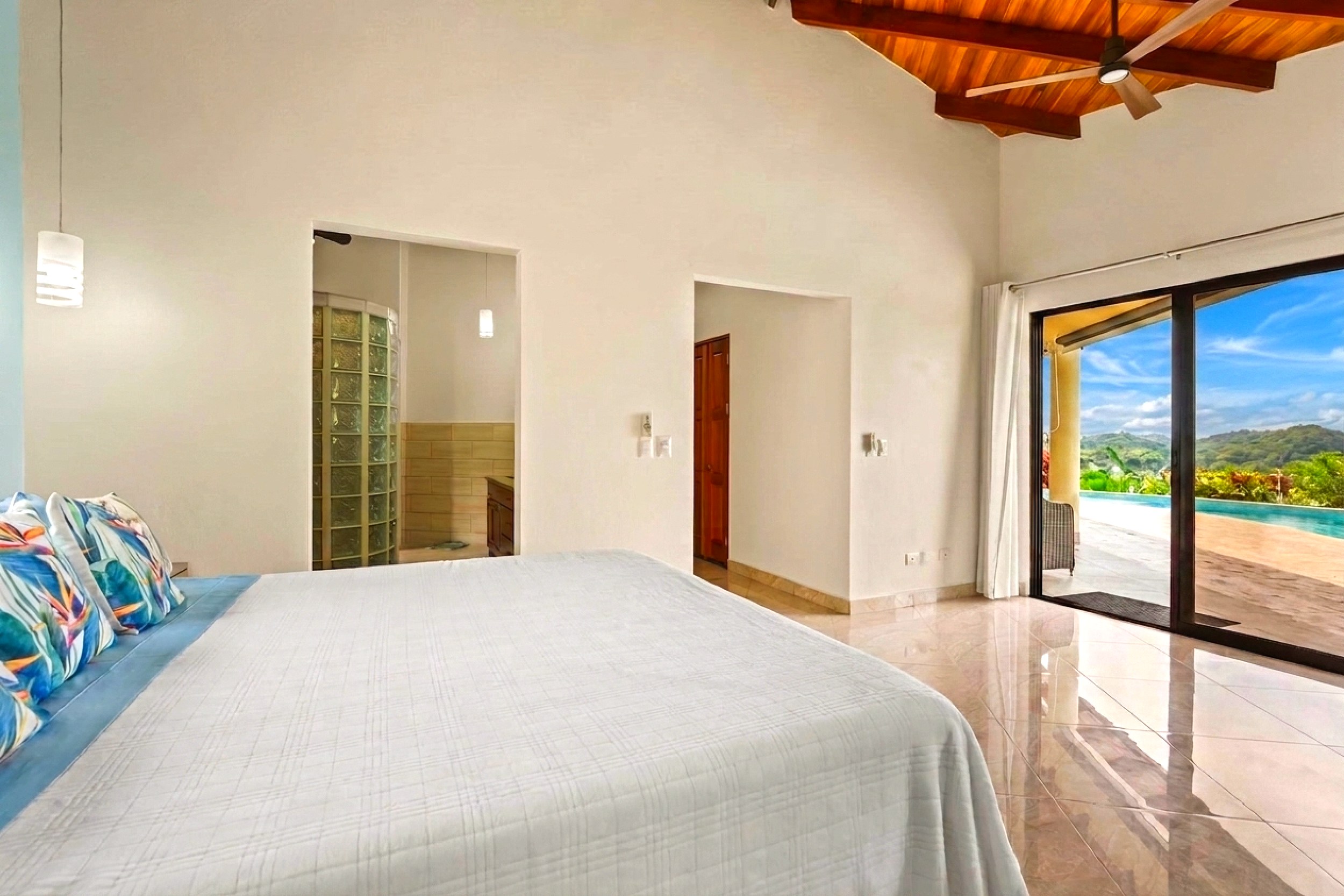 Luxurious Ocean View Home master bedroom opening to pool in Chontales, Costa Rica