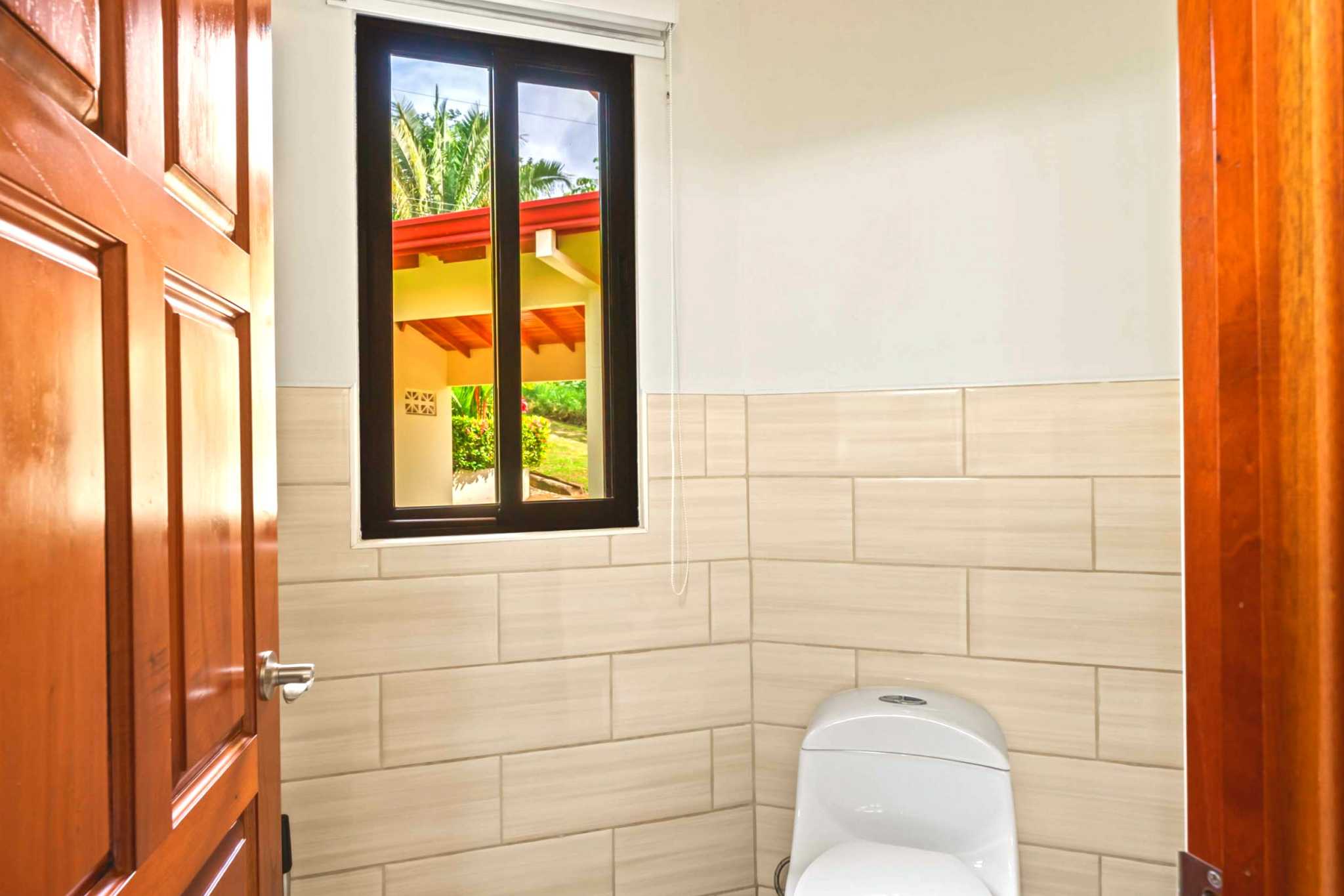 Main Guest Bathroom Luxurious Home guest bathroom toilet and window in Chontales, Costa Rica
