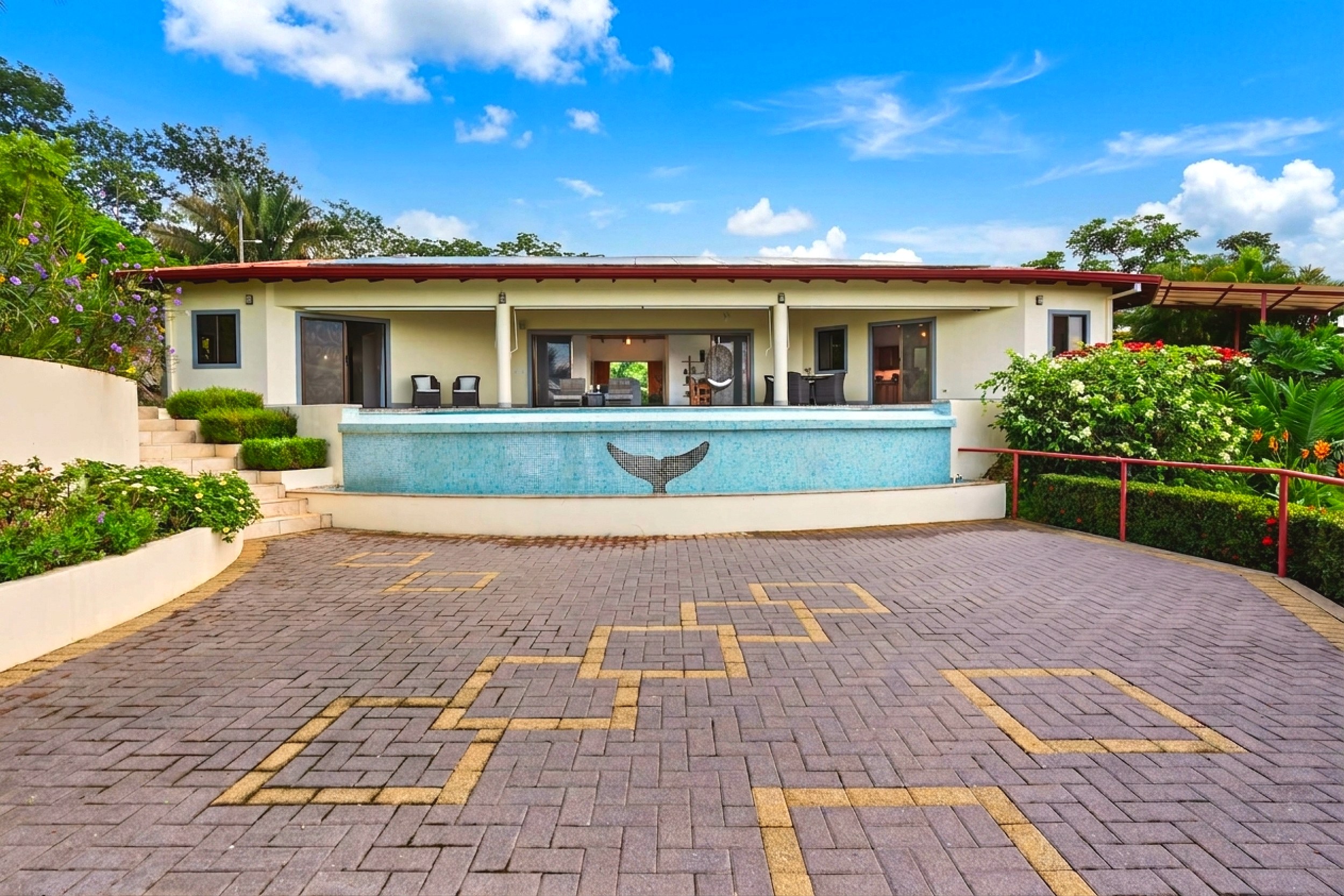 Luxurious Outdoor Living Home elevated pool with whale tail in Chontales, Costa Rica.
