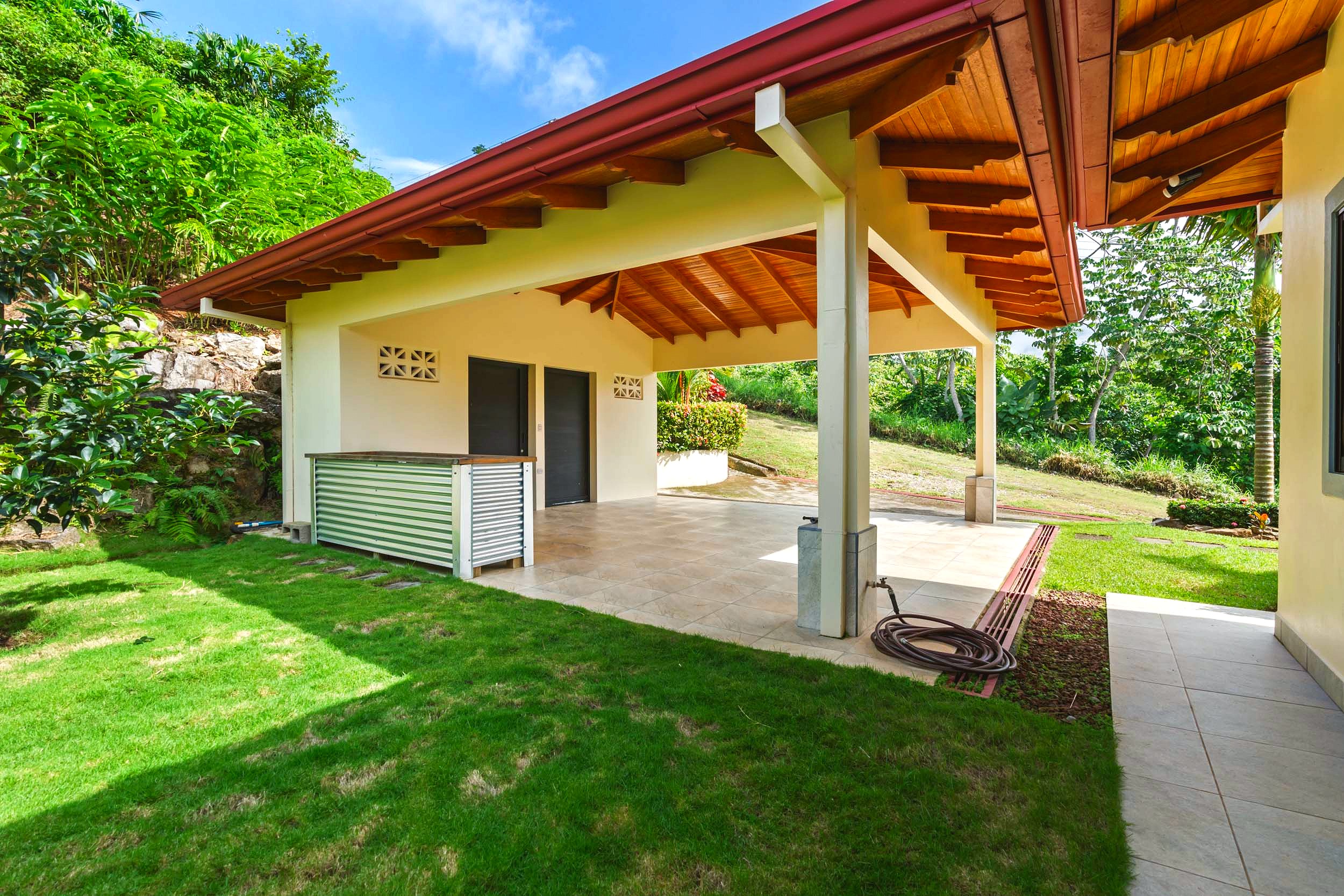 Luxurious Ocean View Home covered carport with tiled floor in Chontales, Costa Rica.
