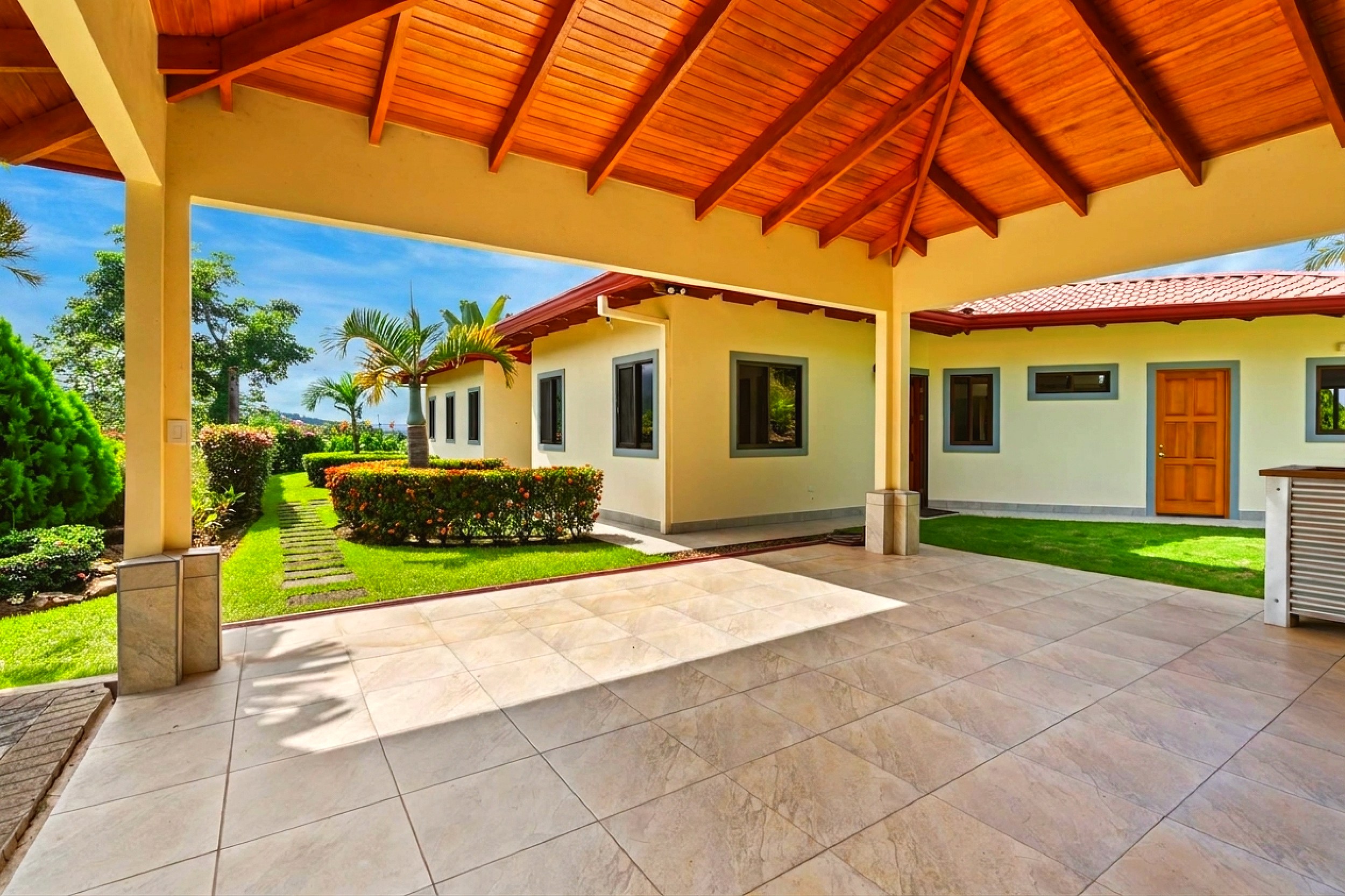 Luxurious Ocean View Home covered tiled carport with wood ceiling in Chontales, Costa Rica.