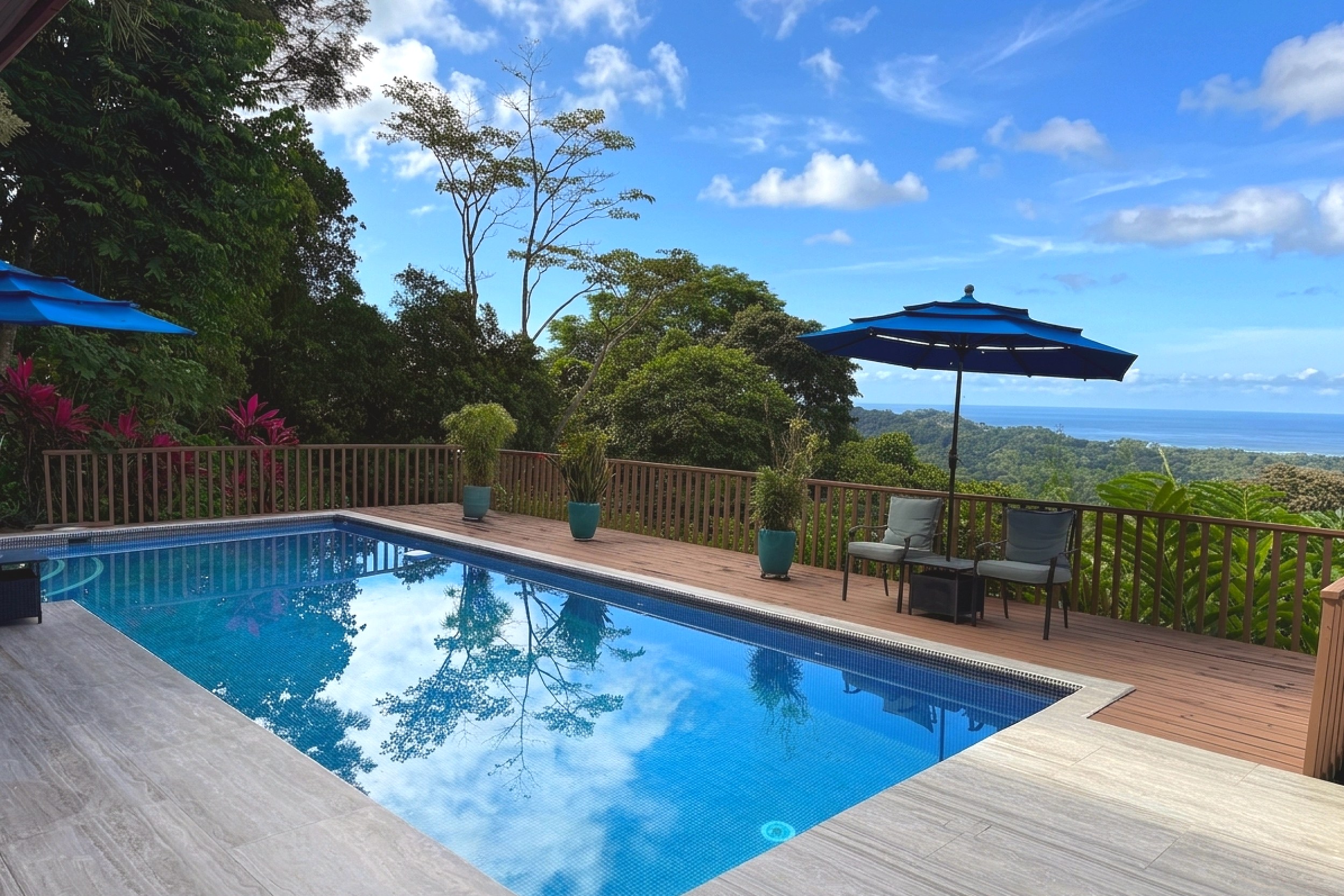 Pool with Panoramic Ocean Views Panoramic Ocean View Home pool deck with mountain and ocean views in Ojochal, Costa Rica