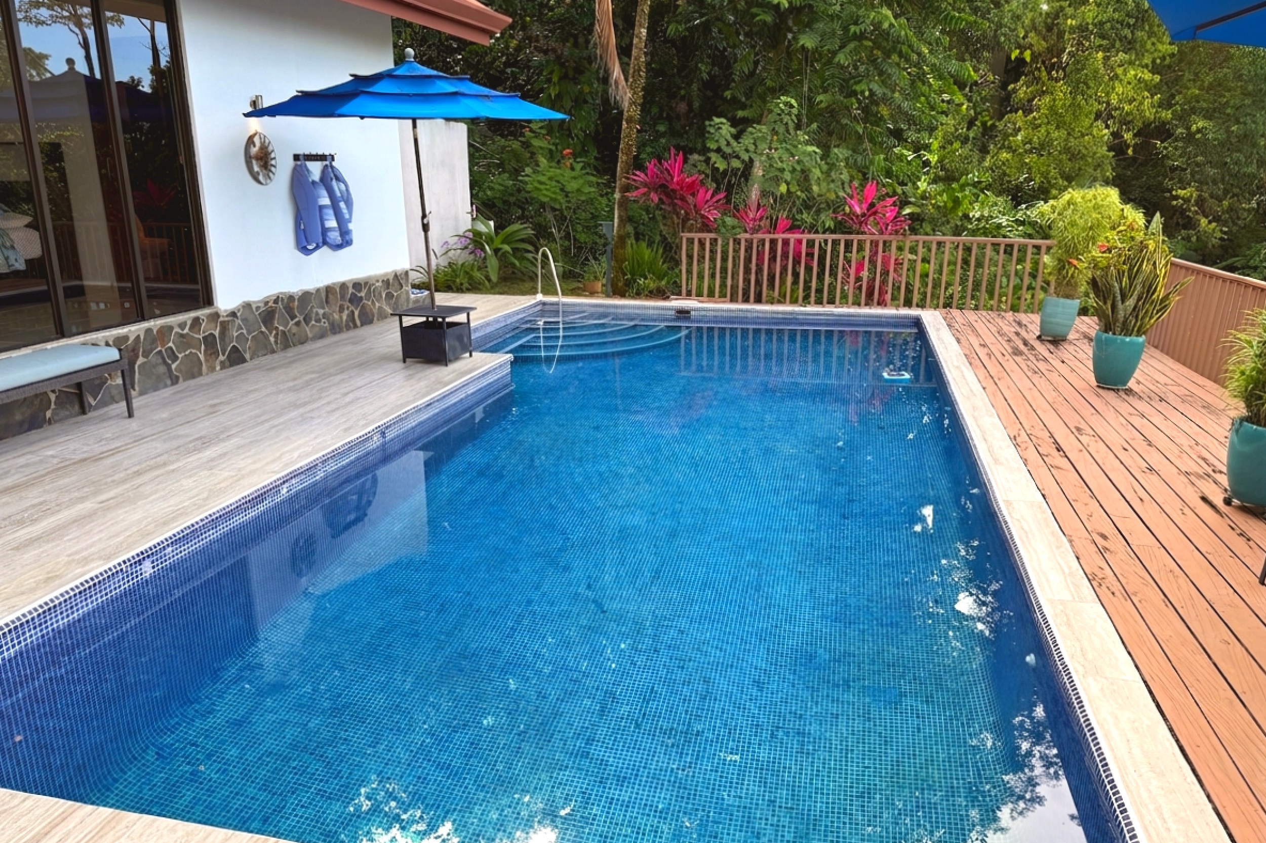 Big Pool & Deck Ocean View Home large tiled pool with wooden deck in Ojochal, Costa Rica