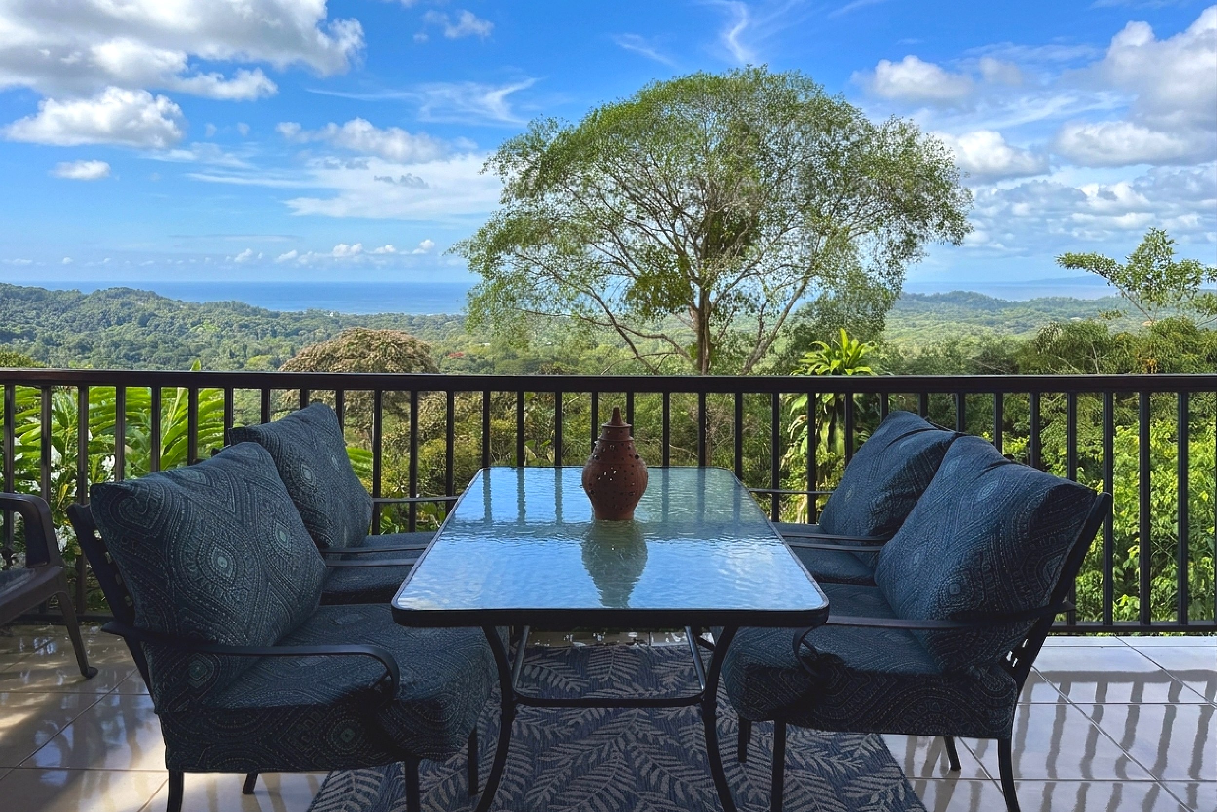 Terrace with Ocean View Ocean View Home covered terrace with lounge seating and jungle views in Ojochal, Costa Rica