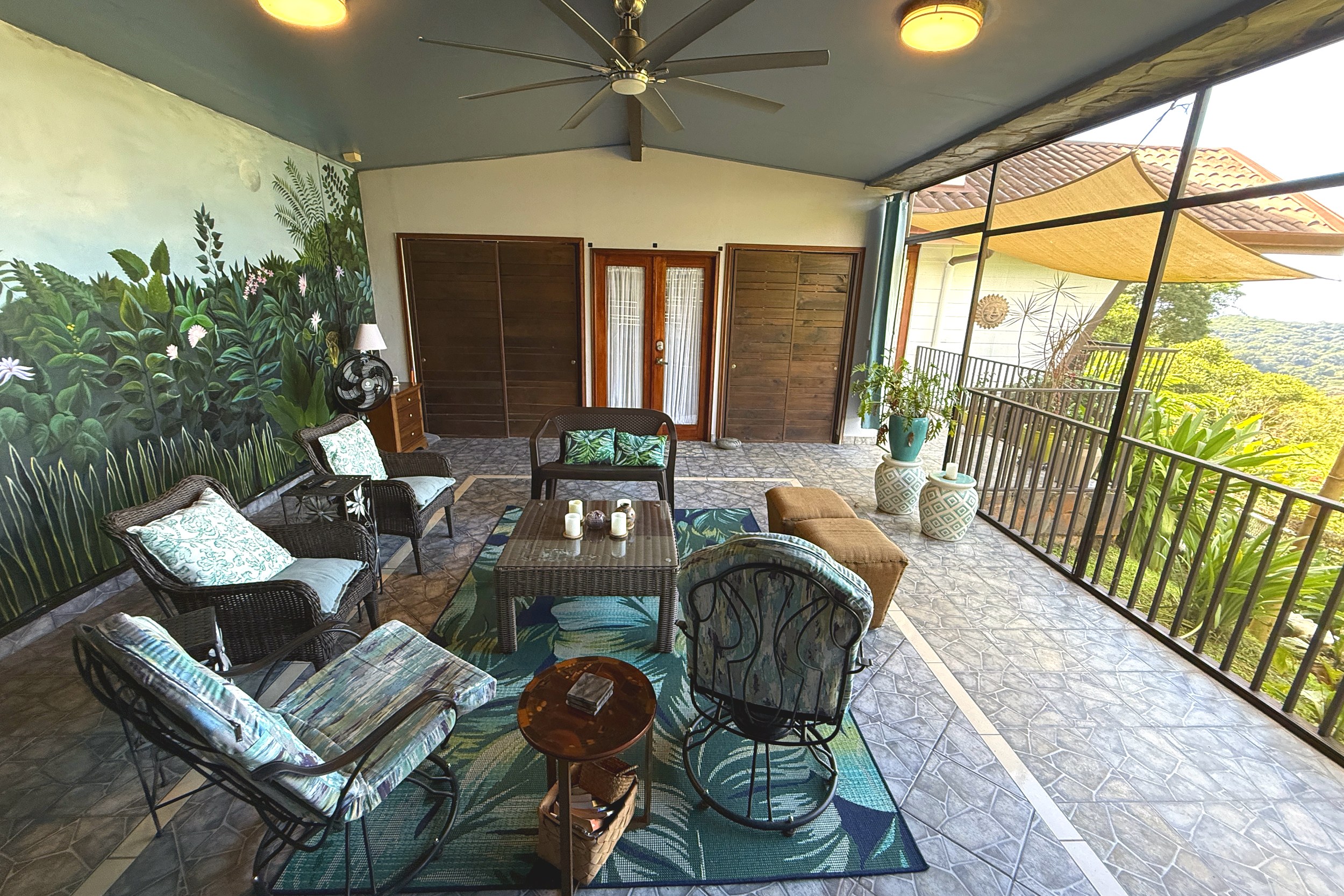 Covered Terrace Lounge Panoramic Ocean View Home covered terrace with wicker lounge seating in Ojochal, Costa Rica