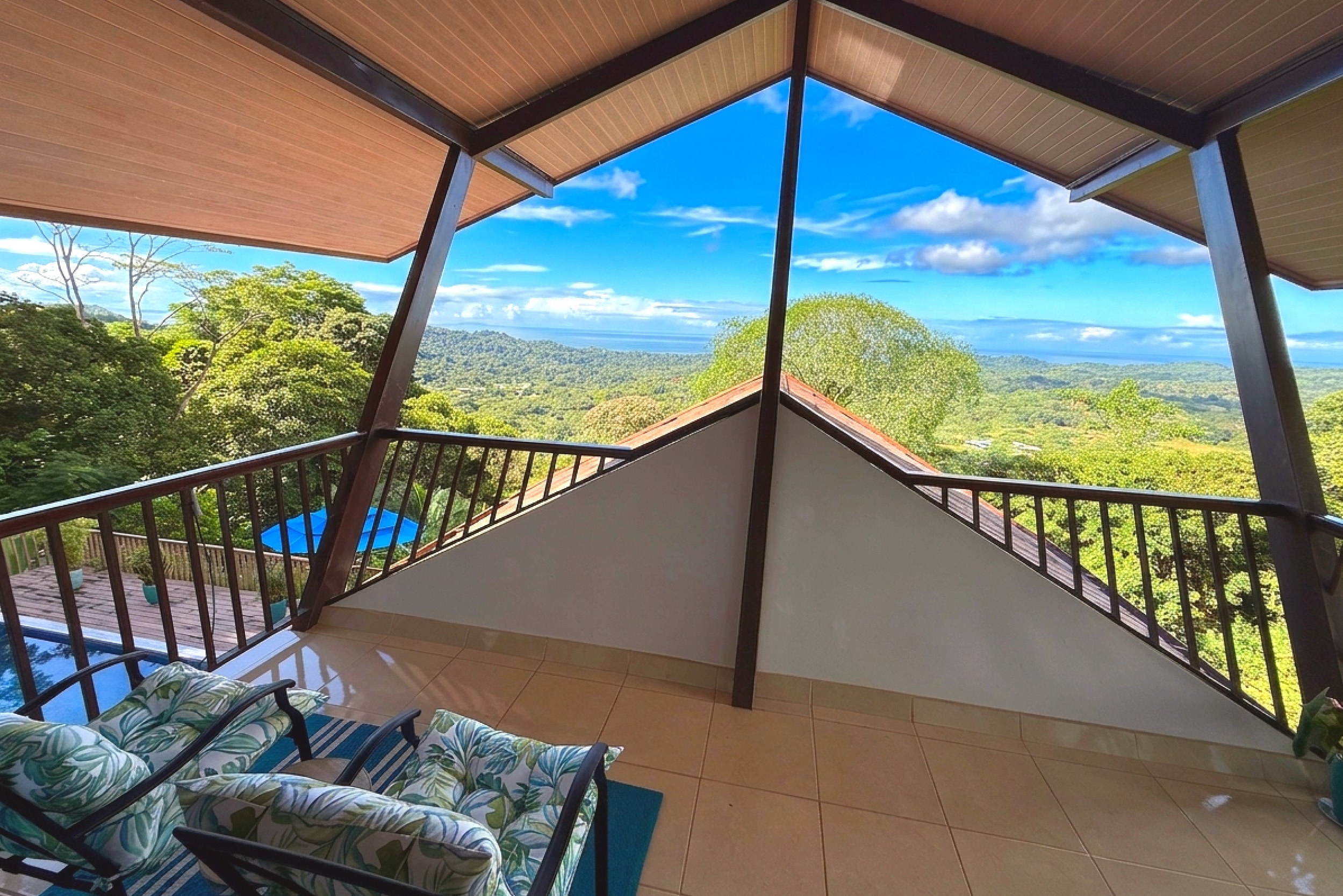 Covered Balcony & Ocean View Panoramic Ocean View Home covered balcony overlooking pool and jungle in Ojochal, Costa Rica