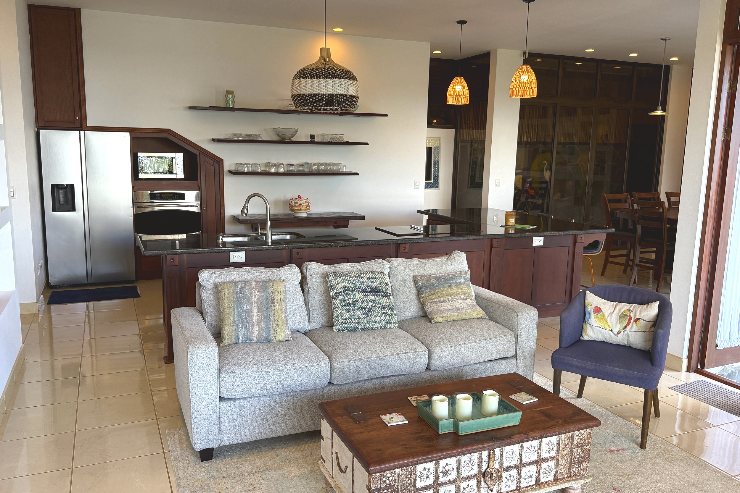 Open-Concept Living & Kitchen Panoramic Ocean View Home living room with kitchen in Ojochal, Costa Rica