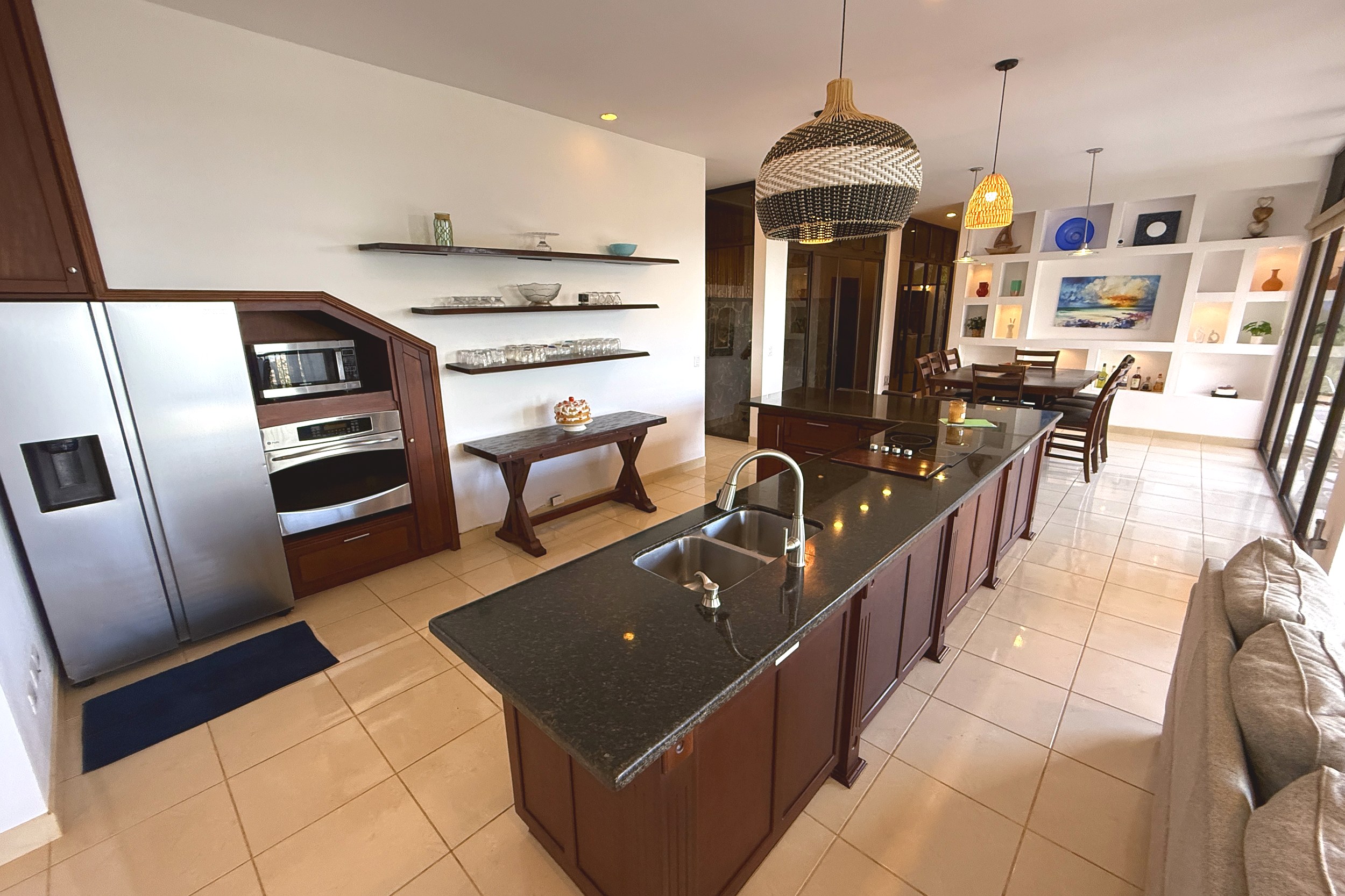 Spacious Granite Island Kitchen Ocean View Home long granite kitchen island with dual sinks in Ojochal, Costa Rica