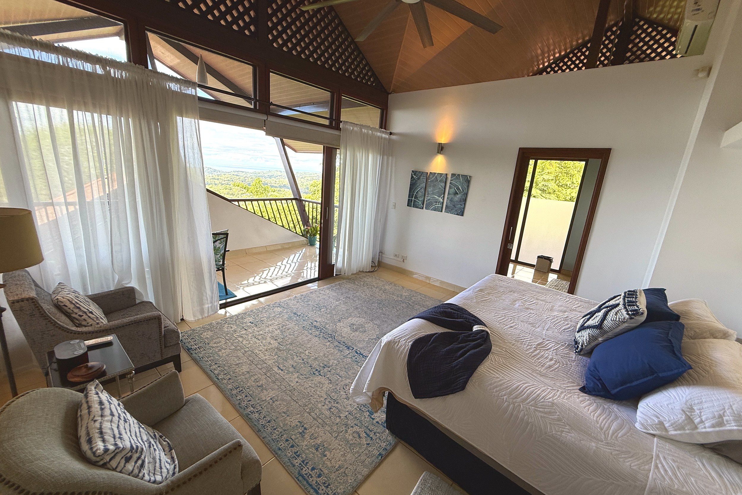 Master Bedroom with Ocean View Panoramic Ocean View Home master bedroom with ocean-view balcony in Ojochal, Costa Rica