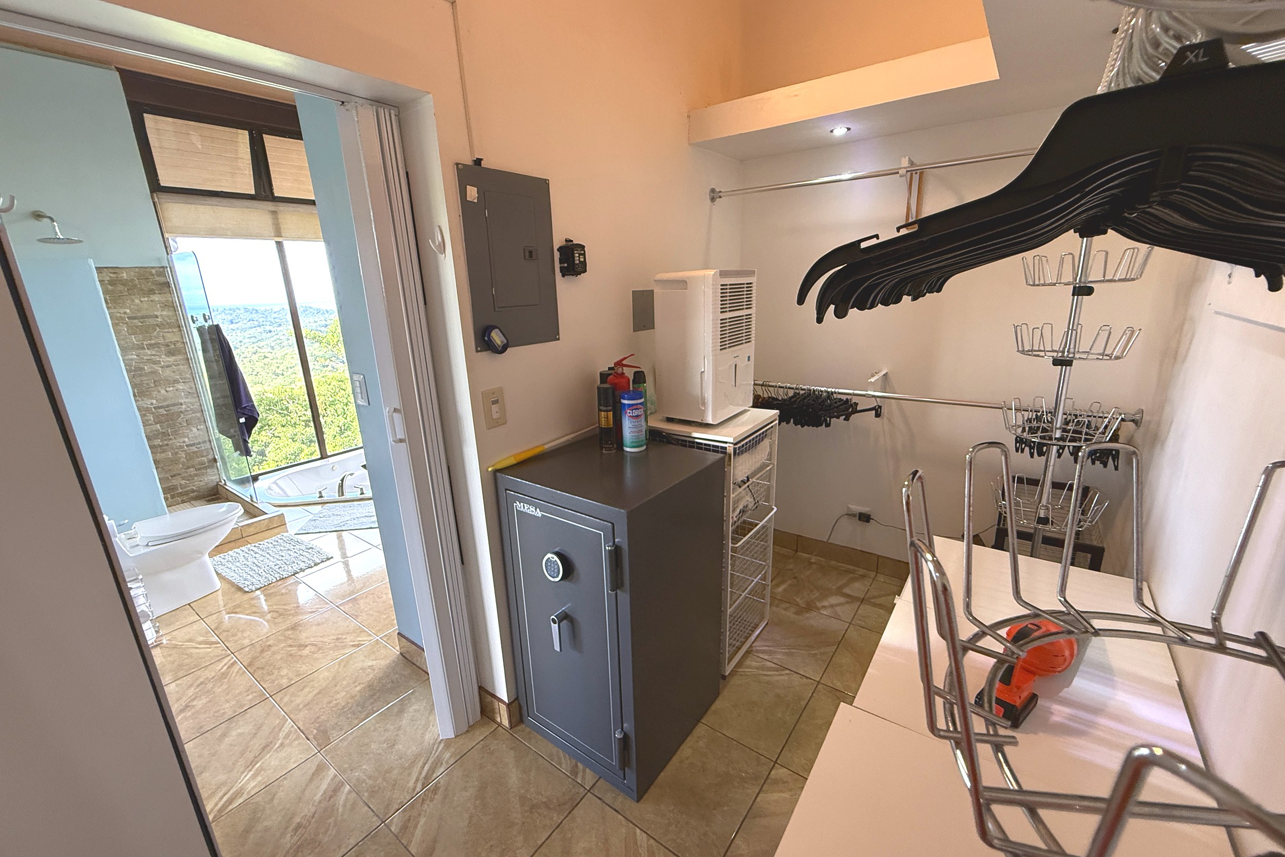 Closet & Storage Nook Panoramic Ocean View Home closet with safe and dehumidifier in Ojochal, Costa Rica