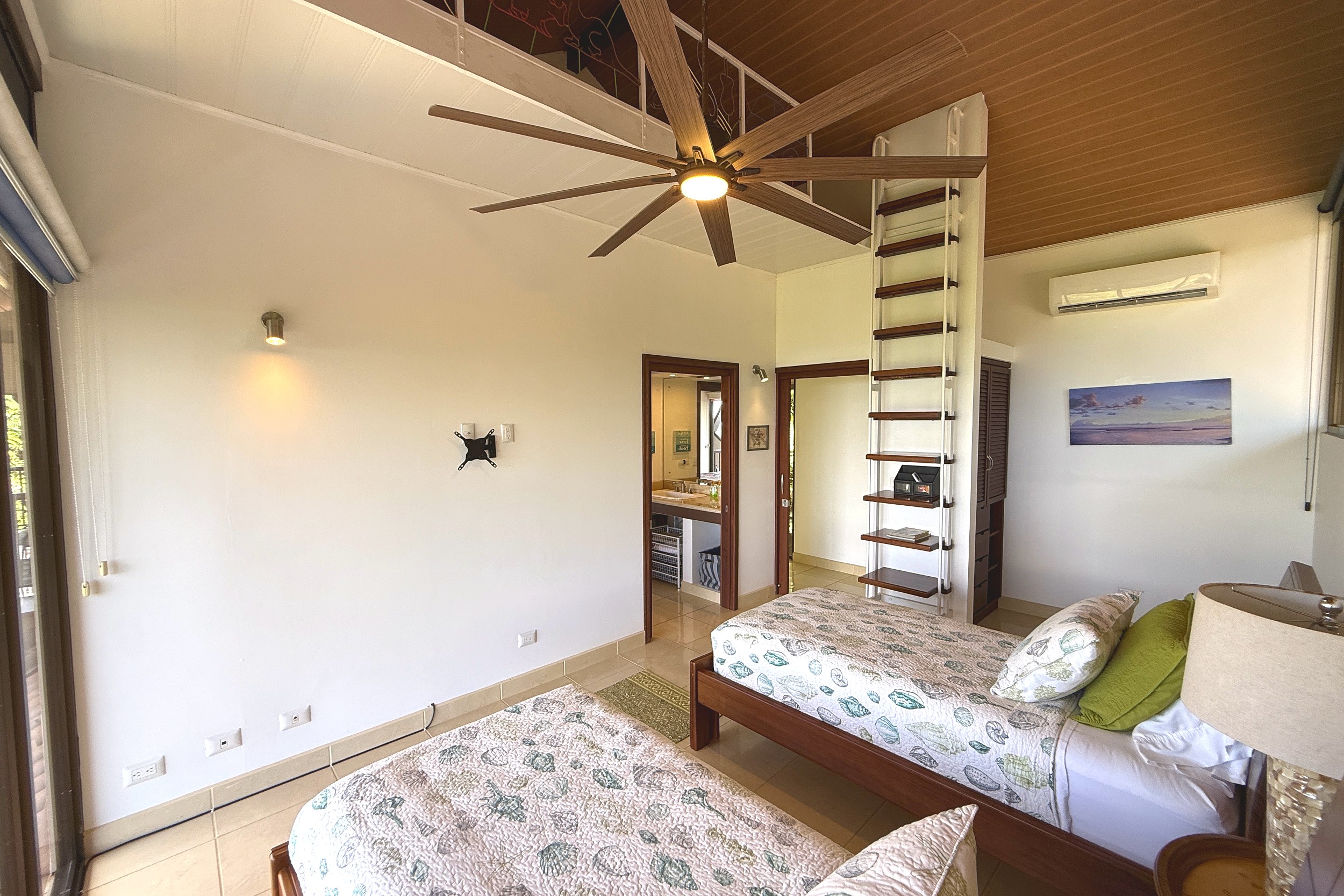 Guest Bedroom with Loft Access Panoramic Ocean View Home twin beds with loft ladder & ceiling fan in Ojochal, Costa Rica