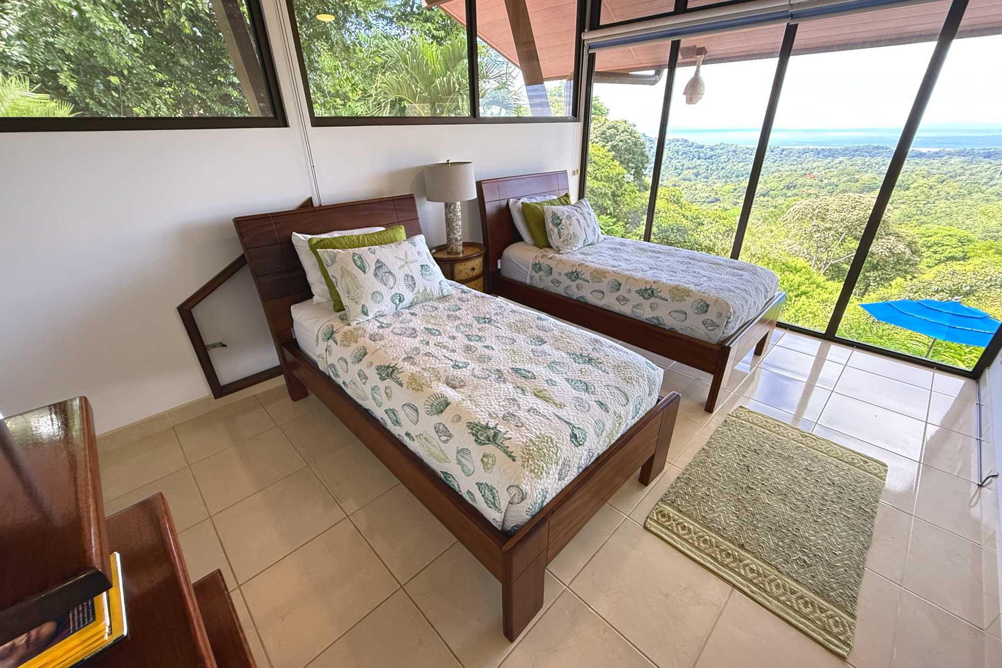 Panoramic Ocean View Home twin beds with ocean view windows in Ojochal, Costa Rica
