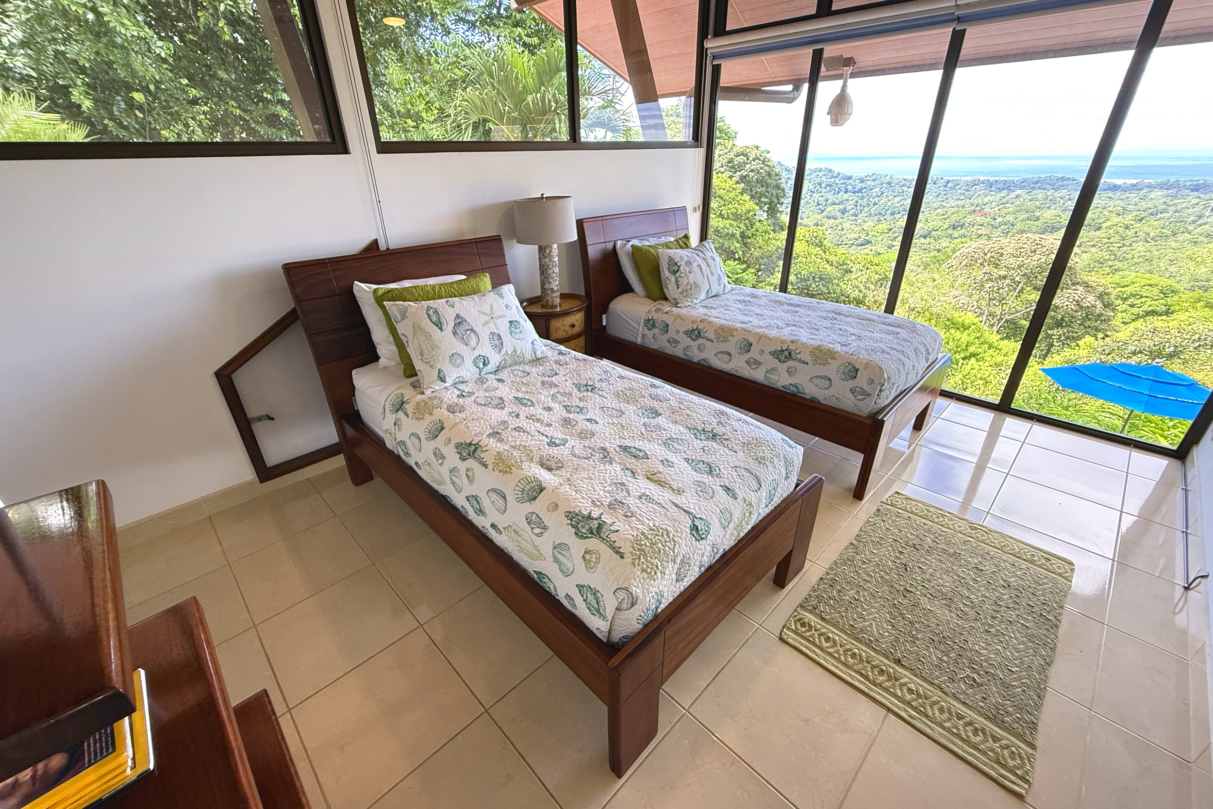 Guest Bedroom Ocean View Panoramic Ocean View Home twin beds with ocean view windows in Ojochal, Costa Rica