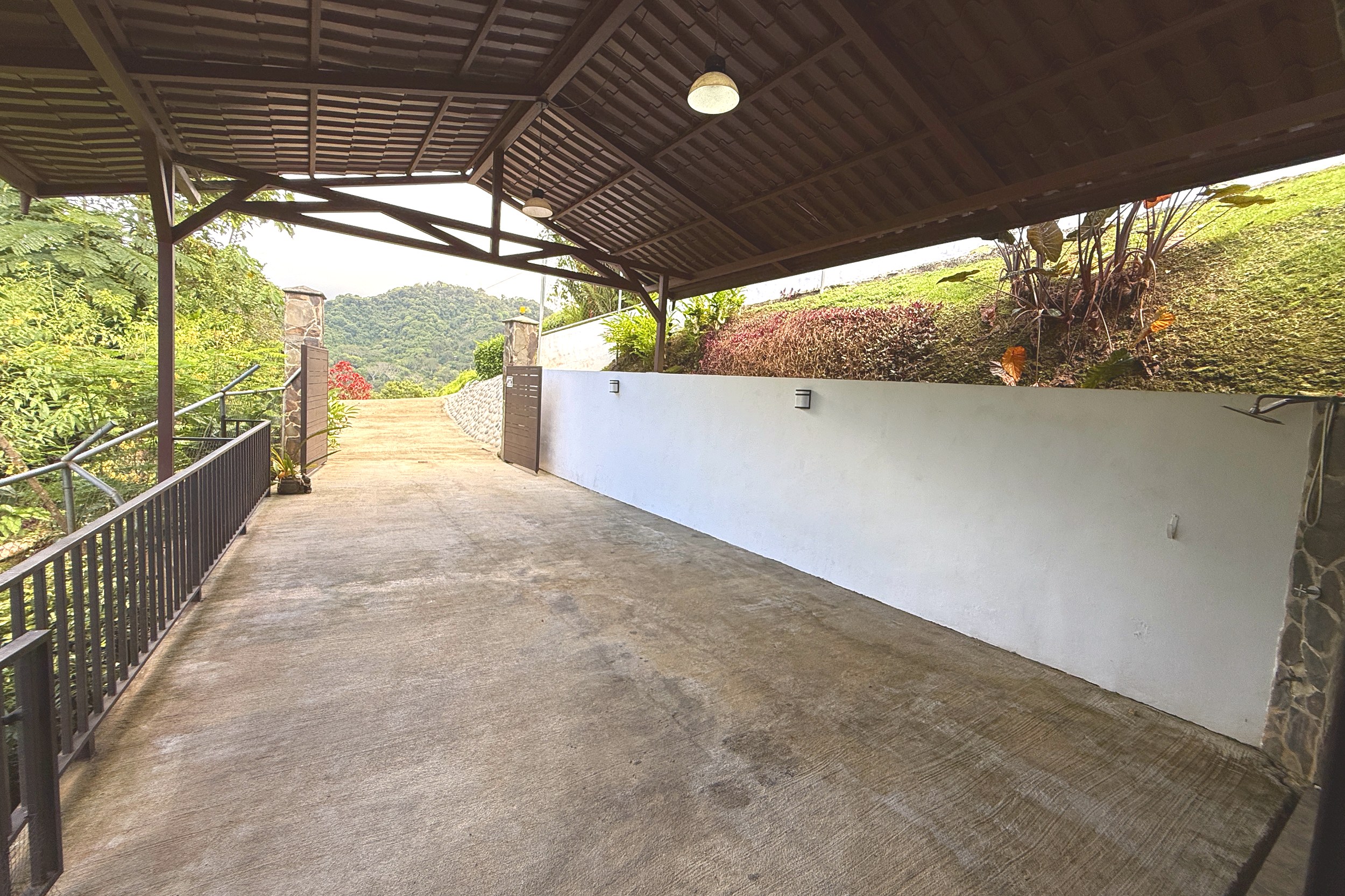Covered Driveway & Mountain View Ocean View Home covered driveway with mountain views in Ojochal, Costa Rica
