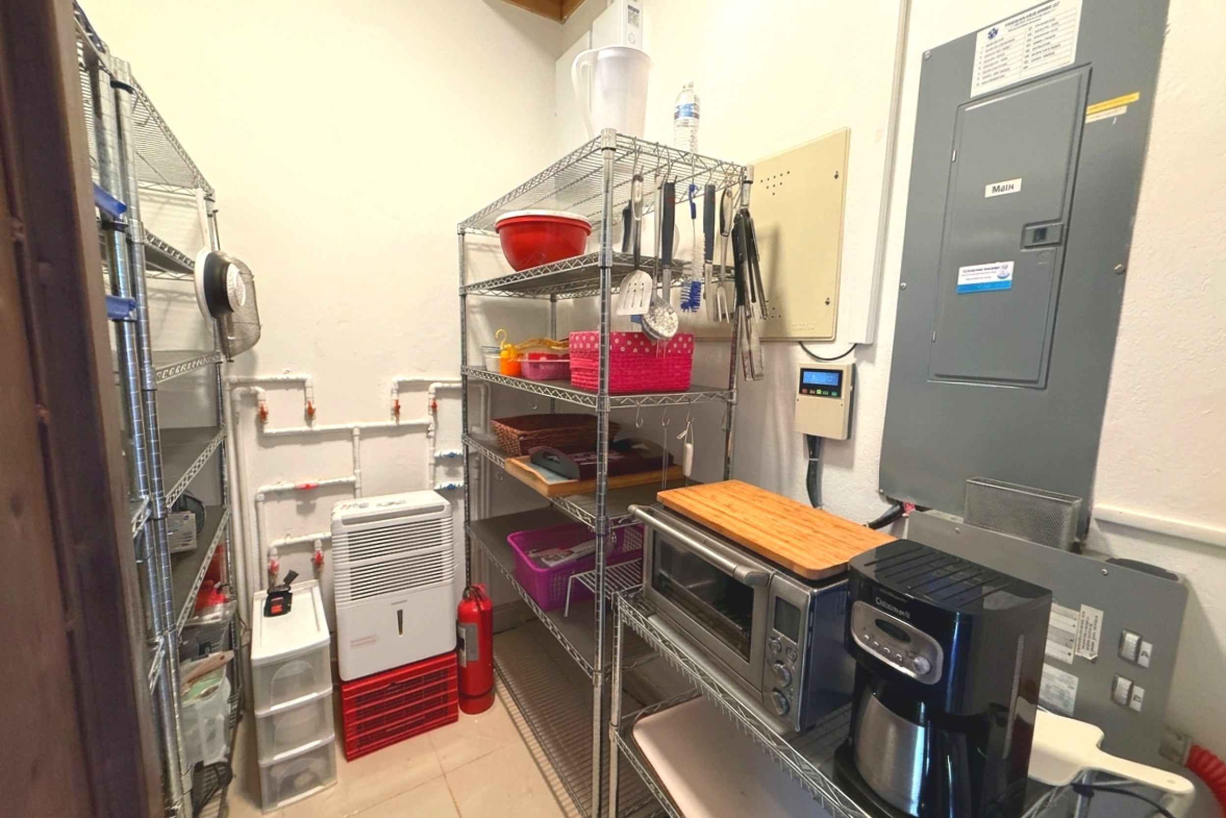 Utility & Storage Room Ocean View Home utility room with shelving, coffee maker and toaster oven in Ojochal, Costa Rica