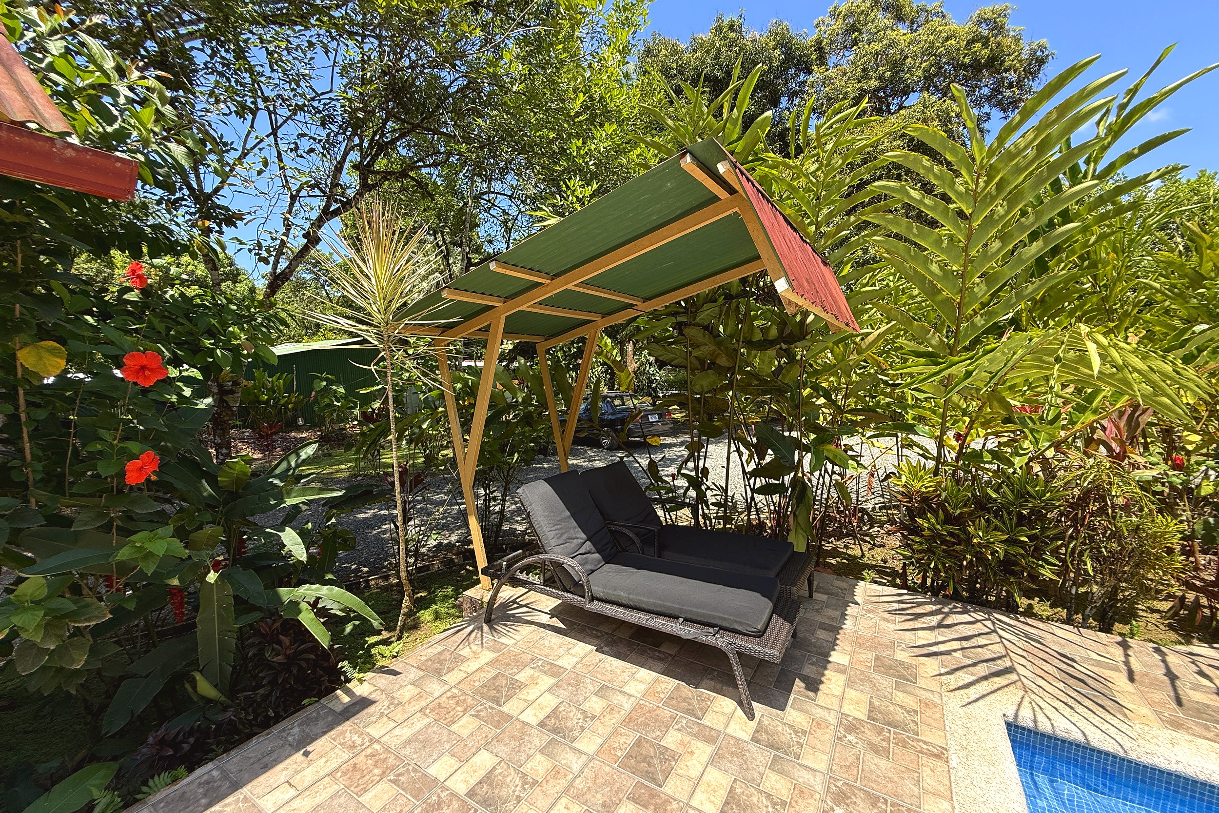 Poolside Lounger & Canopy Jungle Hotel daybed lounger under canopy by pool in Ojochal, Costa Rica