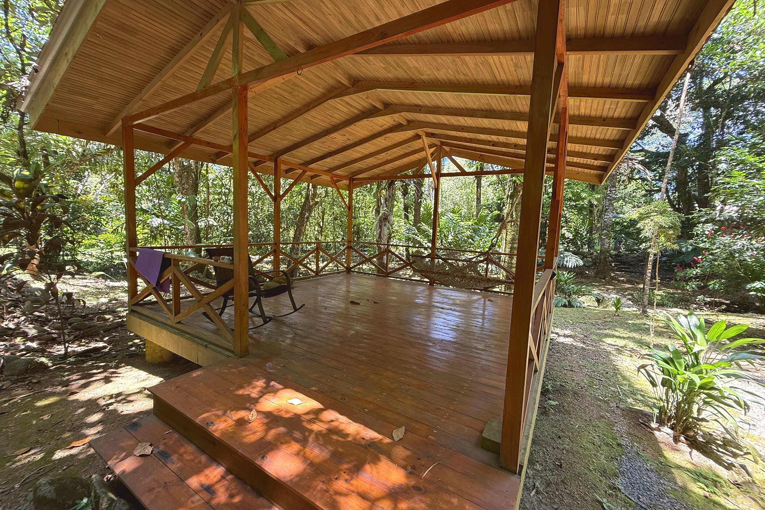 Covered Deck Terrace Jungle Hotel covered wooden deck with forest view in Ojochal, Costa Rica