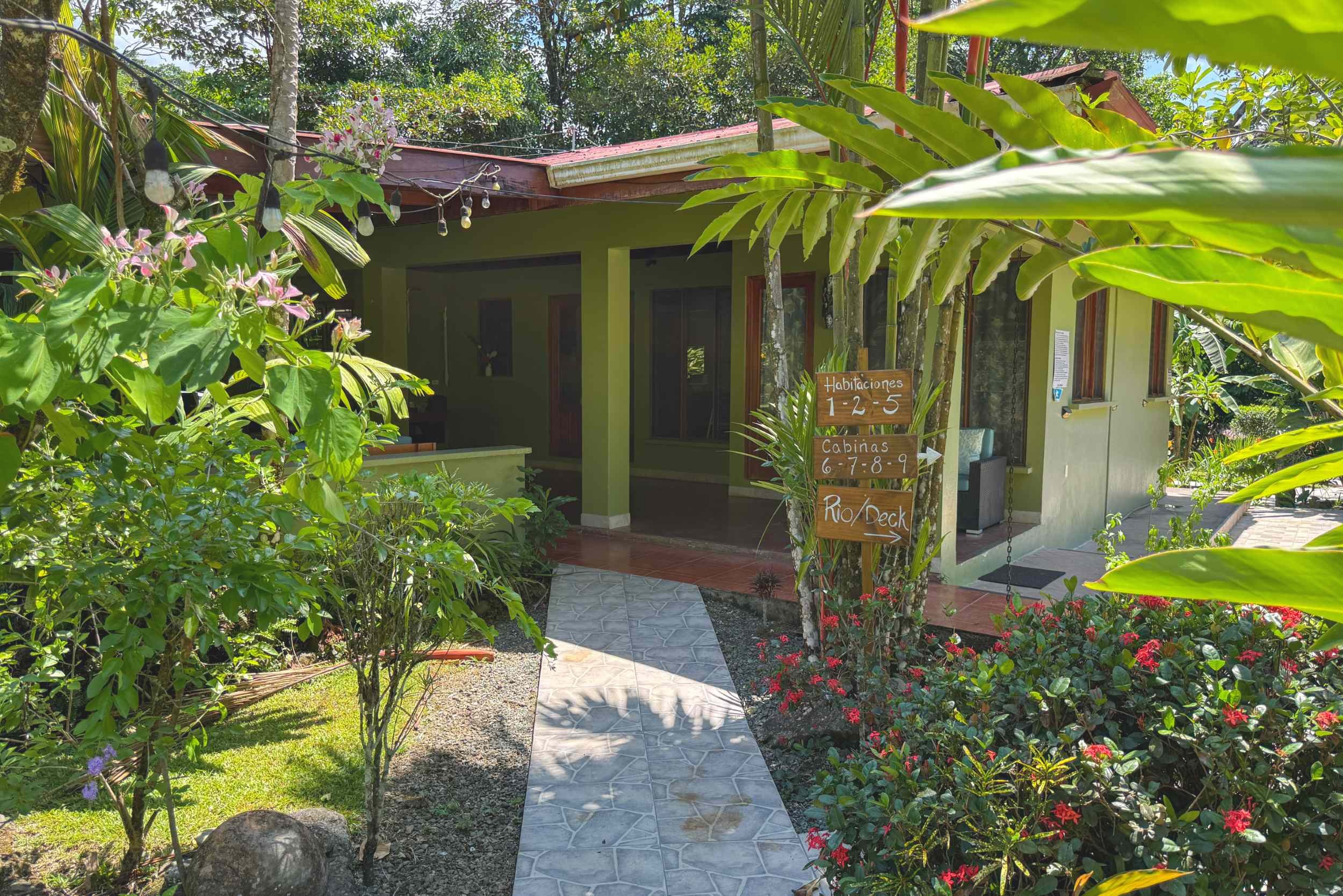 Jungle Entrance Walkway Jungle Hotel tropical entrance walkway with cabina signage in Ojochal, Costa Rica
