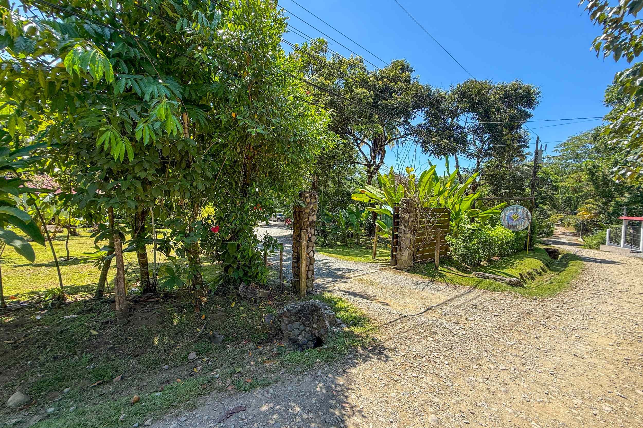 Jungle Entrance Driveway Jungle Hotel gravel driveway entrance with stone pillars in Ojochal, Costa Rica