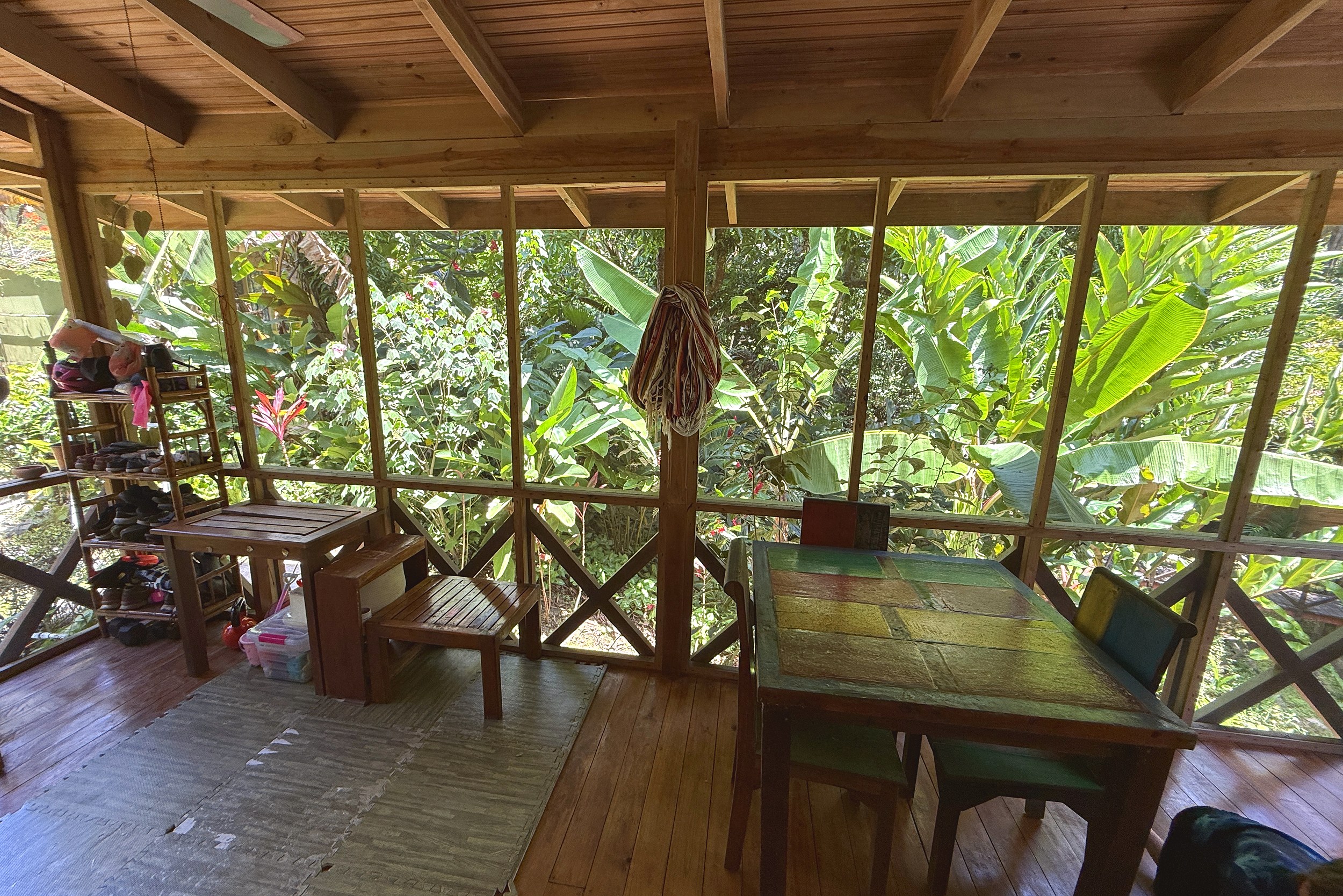 Screened Porch Dining Area Jungle Hotel screened porch dining area with jungle views in Ojochal, Costa Rica