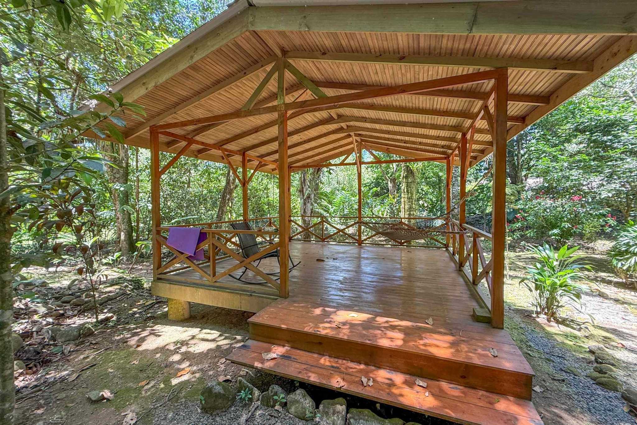 Jungle Hotel wooden pavilion deck with hammock in Ojochal, Costa Rica