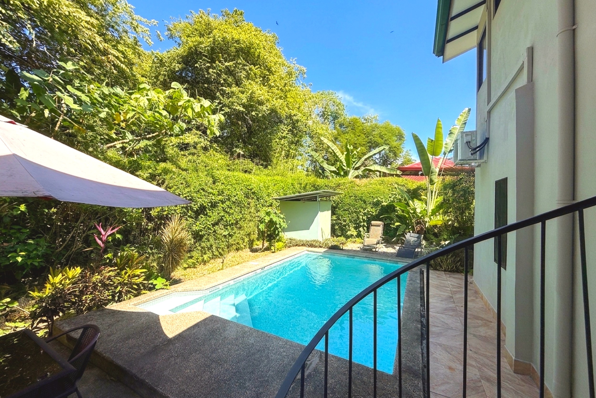 Private Pool & Jungle Views Jungle Sanctuary private pool surrounded by lush greenery in Ojochal, Costa Rica.