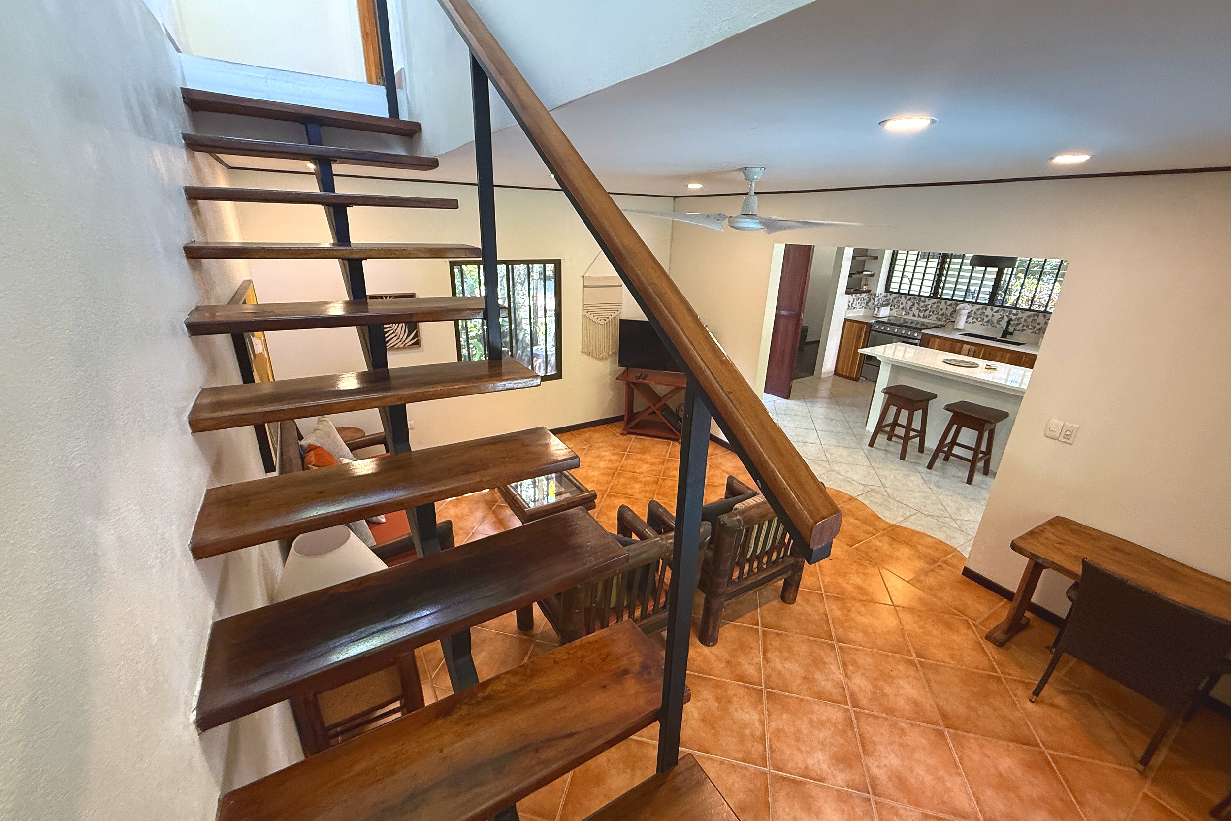 Open Wooden Staircase Jungle Sanctuary open staircase to tiled living area in Ojochal, Costa Rica