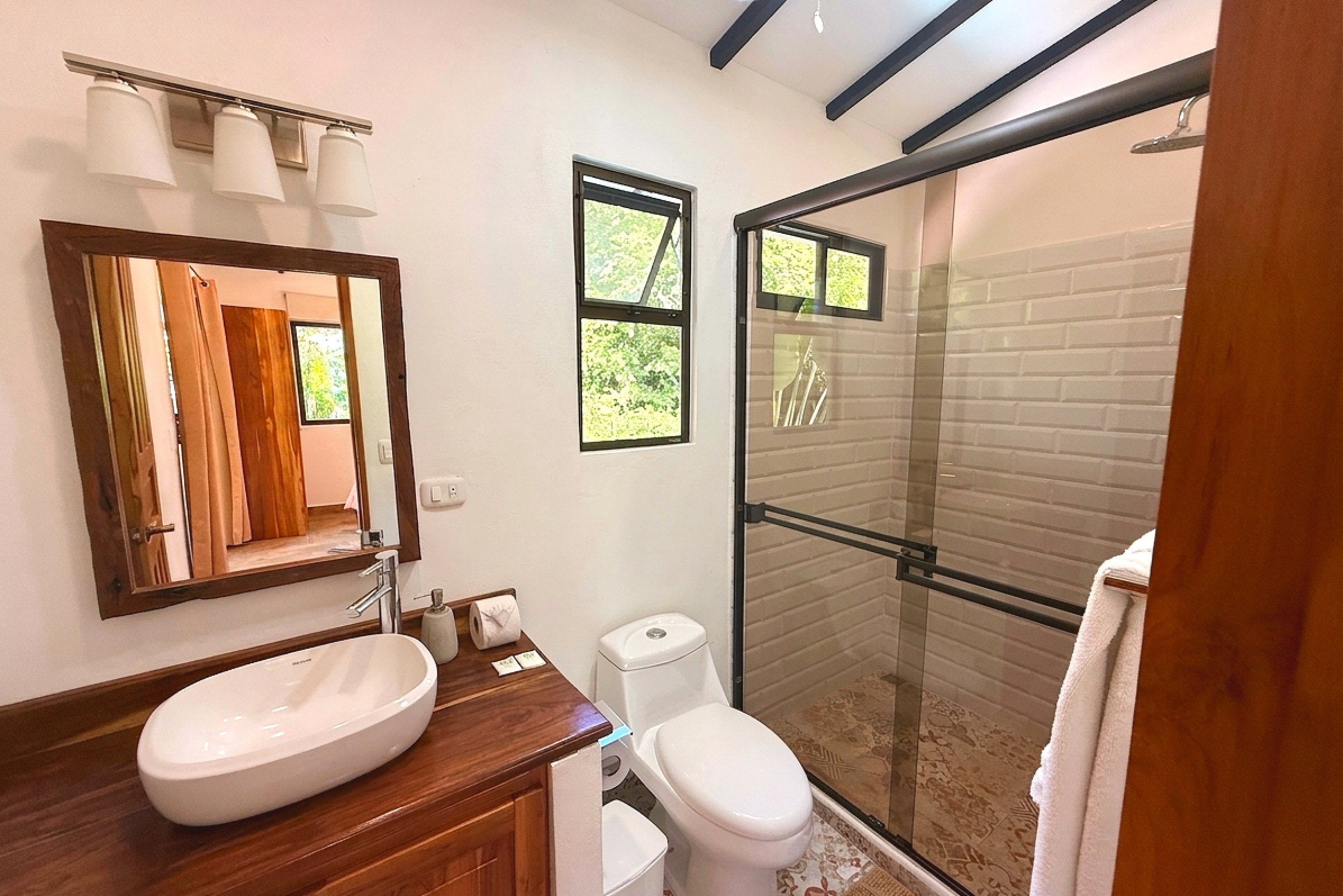 Master Bathroom Vanity & Shower Serene Jungle Sanctuary vessel sink vanity and glass-enclosed shower in Ojochal, Costa Rica