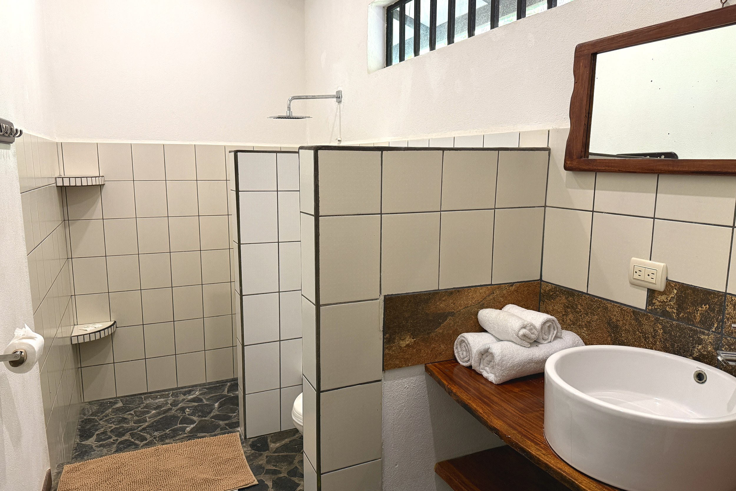 Walk-In Shower & Vessel Sink Jungle Sanctuary walk-in tile shower and vessel sink bathroom in Ojochal, Costa Rica.